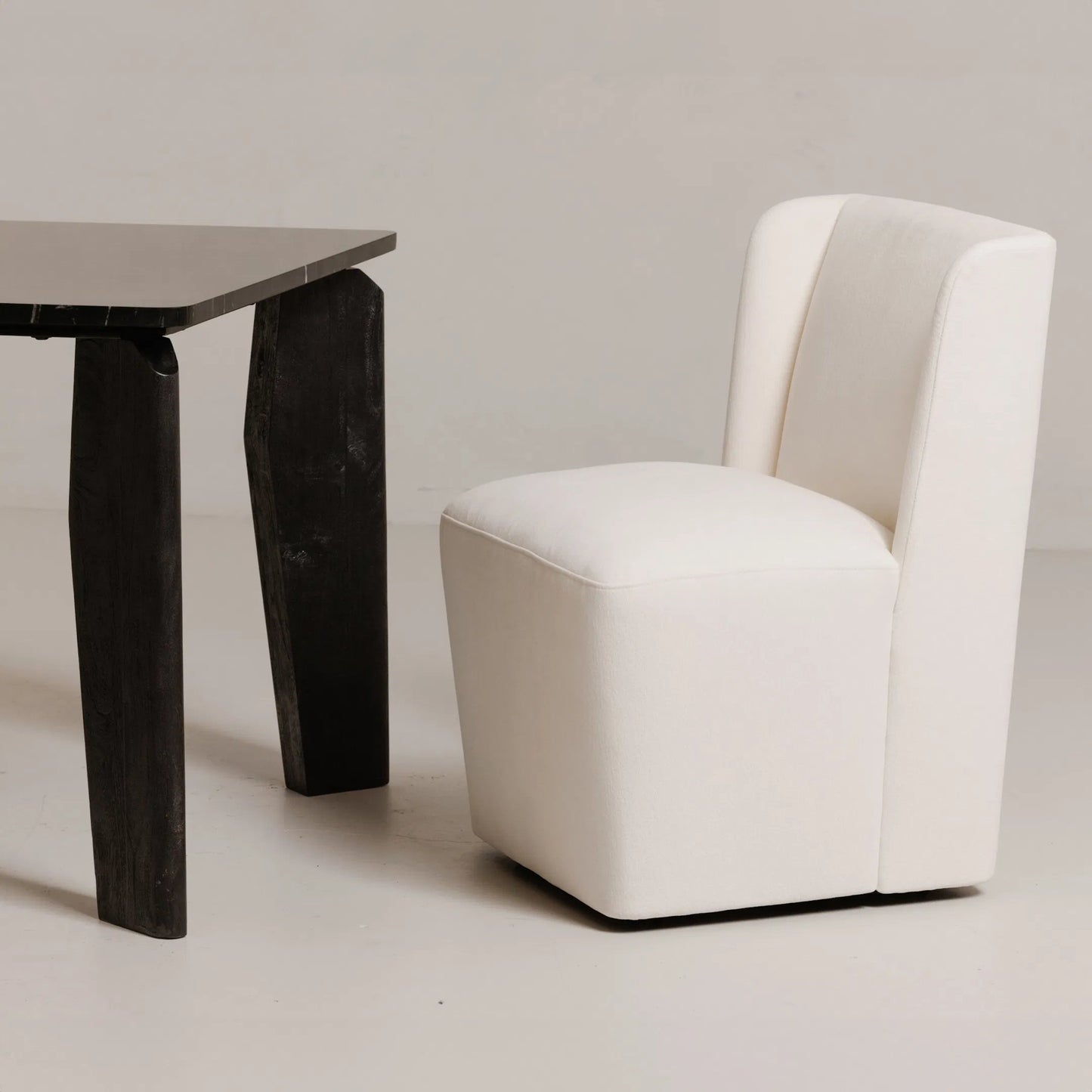 002 SI-2253656 | Lifestyle | Cormac Rolling Dining Chair Performance Fabric by Moe's Home Collection. Made from upholstery: 100% polyester, poplar multi, layer board, laminated veneer lumber, high density foam, metal wheels in a transitional style.