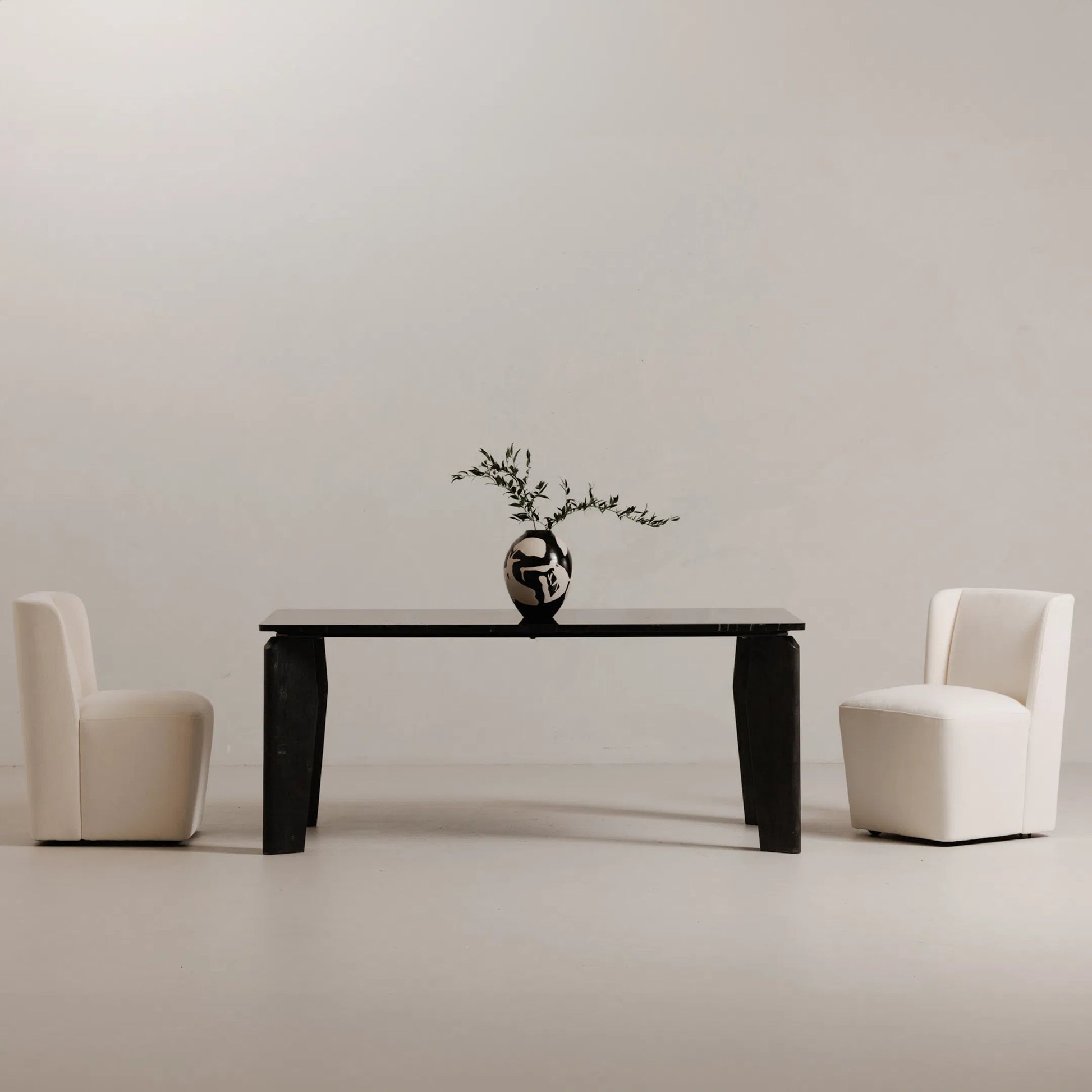 Cormac Rolling Dining Chair by Moe's Home Collection. Made from 100% polyester, poplar multi-layer board, laminated veneer lumber, high density foam, metal wheels in a transitional style.