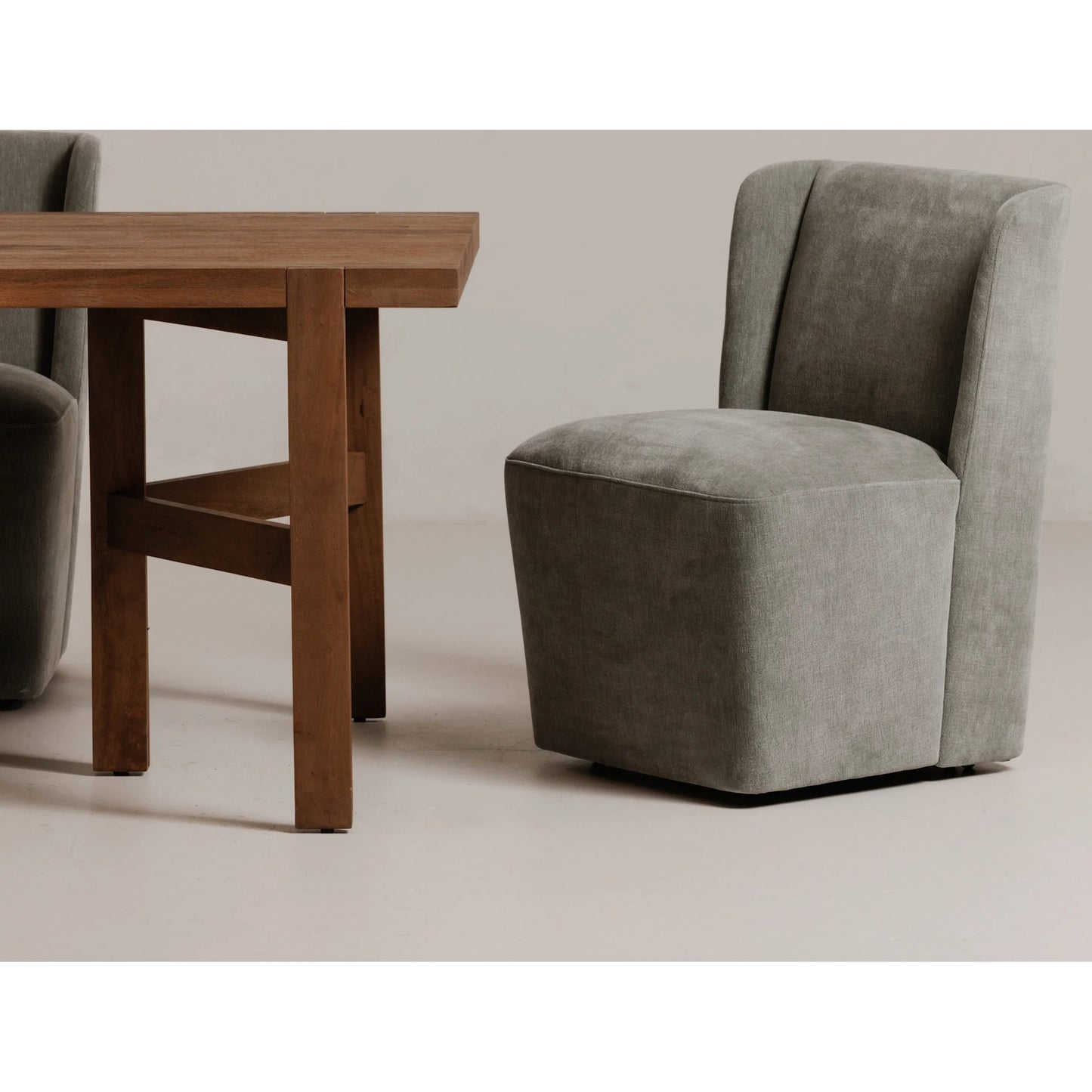 011 SI-2441343 | Lifestyle | Cormac Rolling Dining Chair by Moe's Home Collection. Made from 100% polyester, poplar multi-layer board, laminated veneer lumber, high density foam, metal wheels in a transitional style.