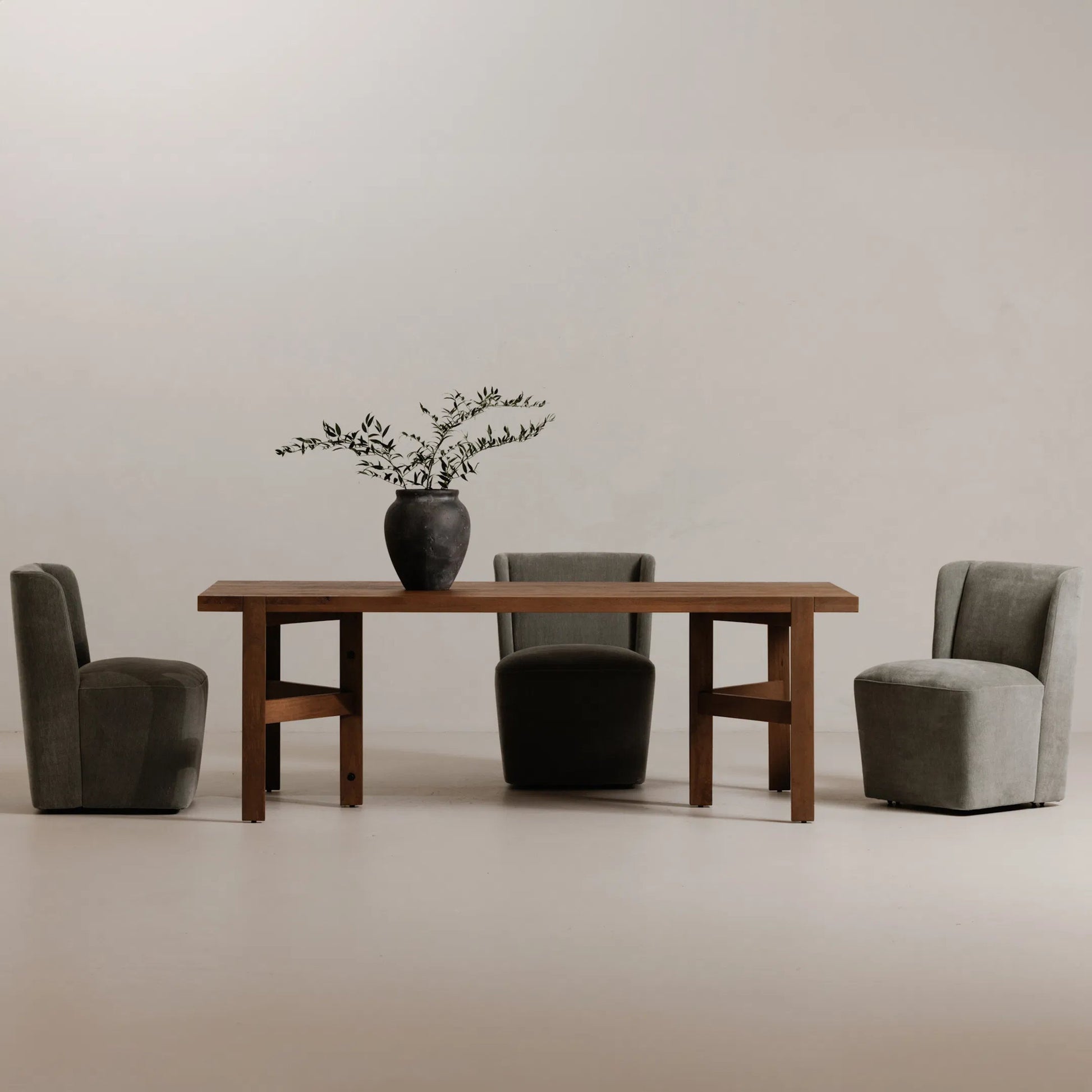 Cormac Rolling Dining Chair by Moe's Home Collection. Made from 100% polyester, poplar multi-layer board, laminated veneer lumber, high density foam, metal wheels in a transitional style.