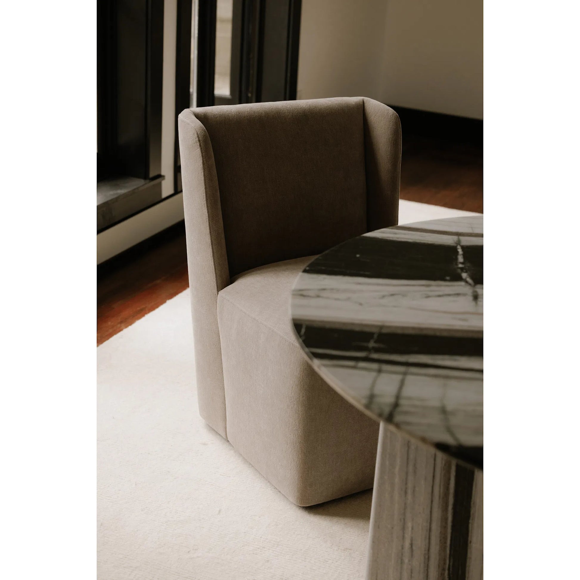 Cormac Rolling Dining Chair Performance Fabric by Moe's Home Collection. Made from upholstery: 100% polyester, poplar multi, layer board, laminated veneer lumber, high density foam, metal wheels in a transitional style.