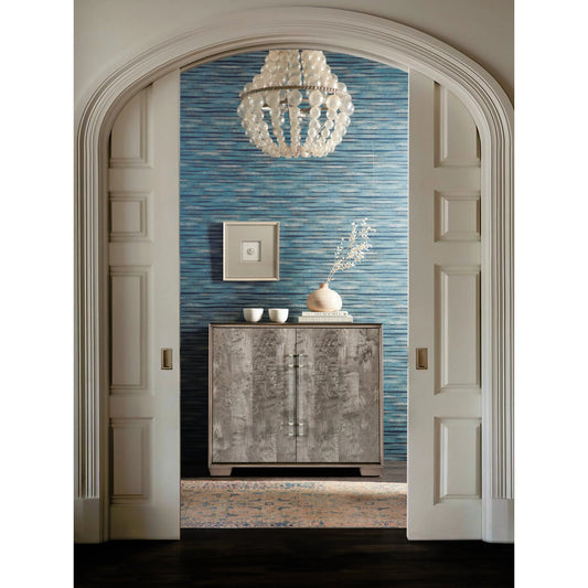 Melange Dorian Accent Chest by Hooker Furniture in medium wood and shimmery wood finish. Made from dyed brown burl figured veneer with maple veneers and acrylic pulls in a modern style.