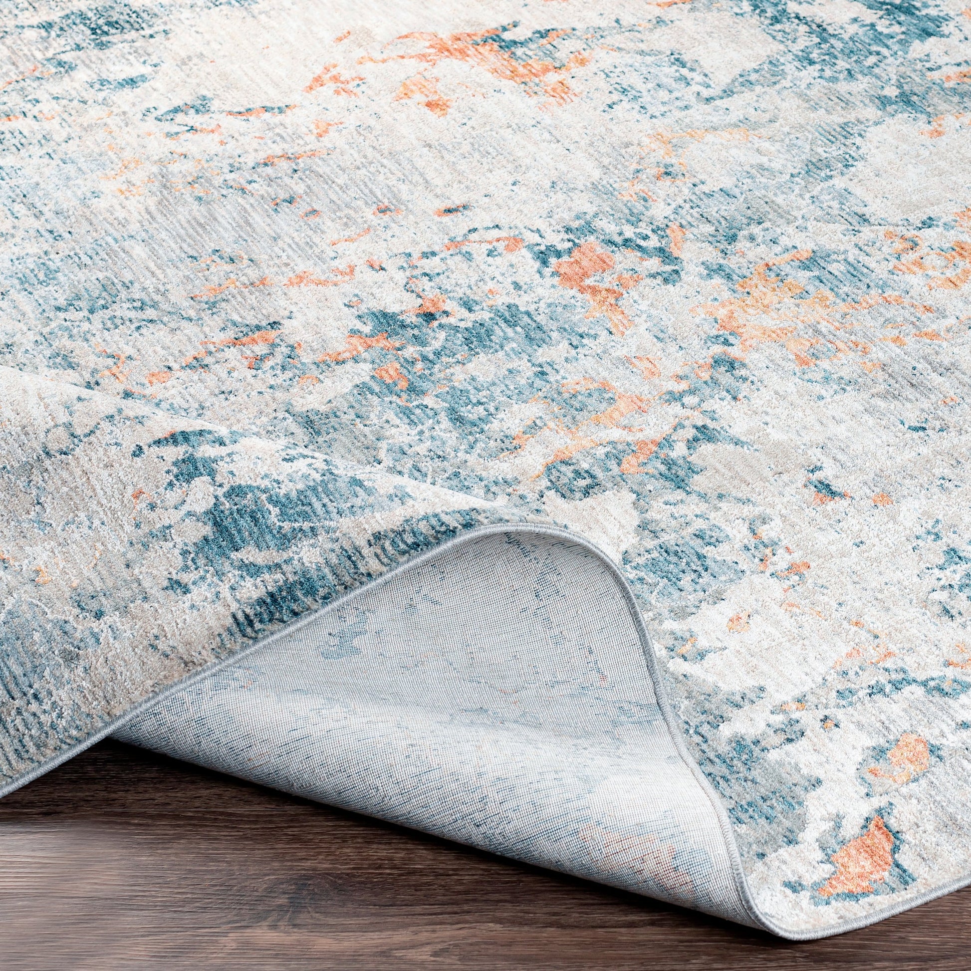 Laila Rug by Livabliss in teal, dusty sage, rust, mustard, gray, light gray. Made from 100% polyester in a modern style.