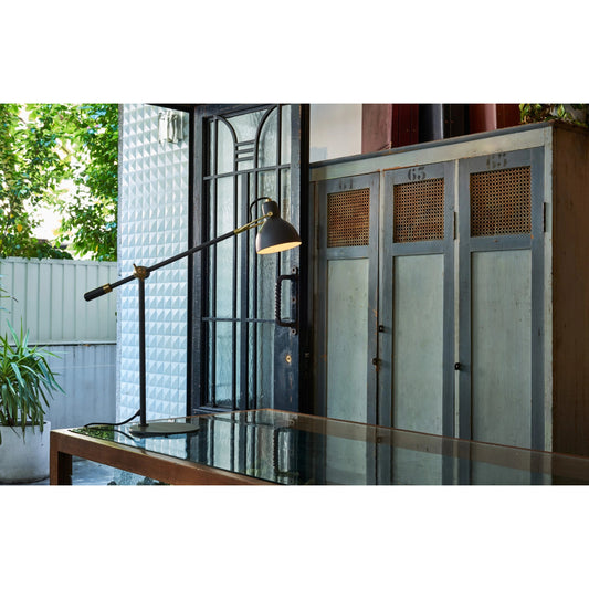 Laito Gentle Table Lamp by Seed Design in black/gold. Made from steel in a modern style.