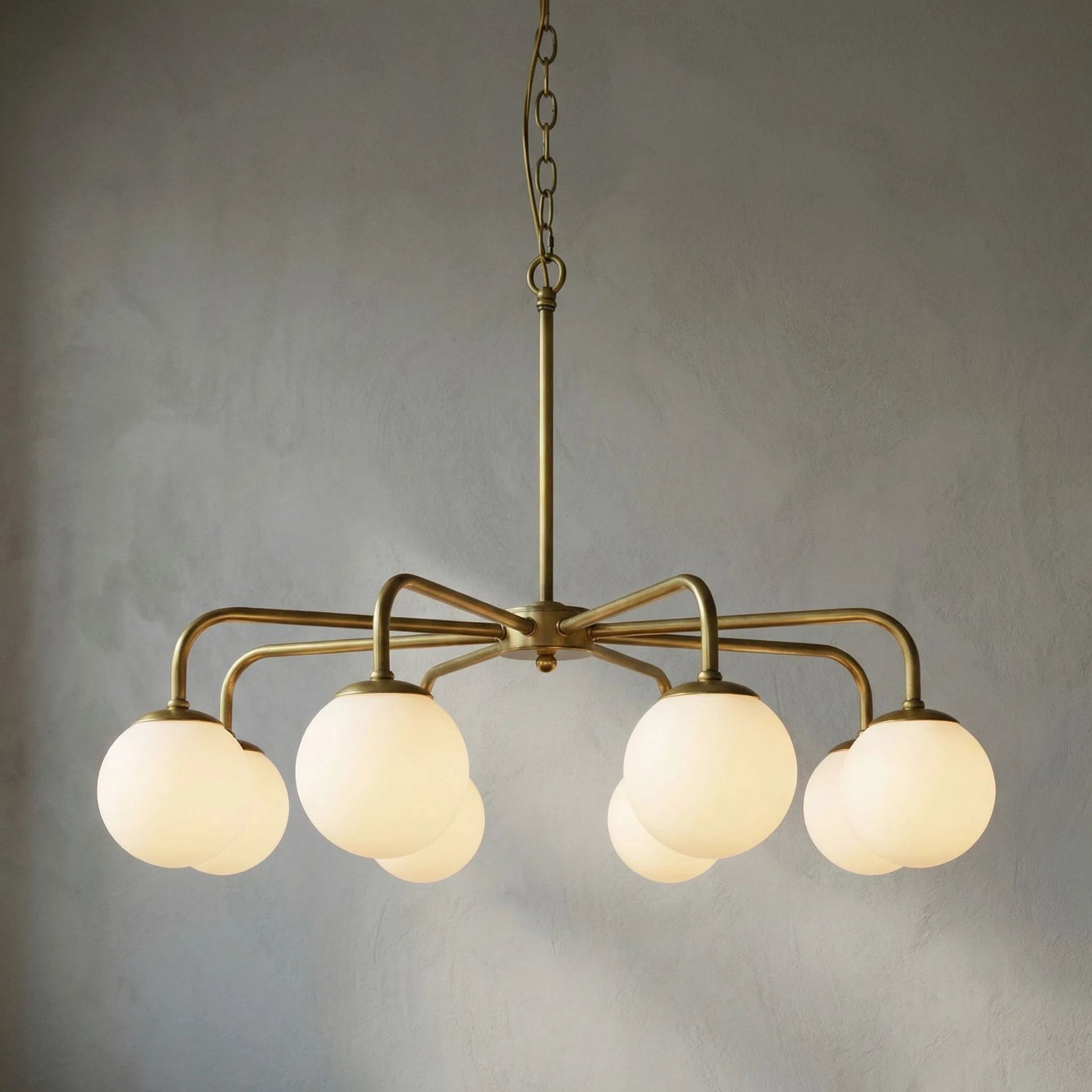 Larenta Chandelier by Noir in antique brass. Made from metal, glass in a modern style.