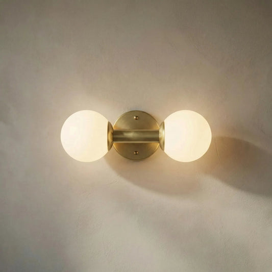 Antiope Sconce by Noir in antique brass. Made from metal, glass in a modern style.