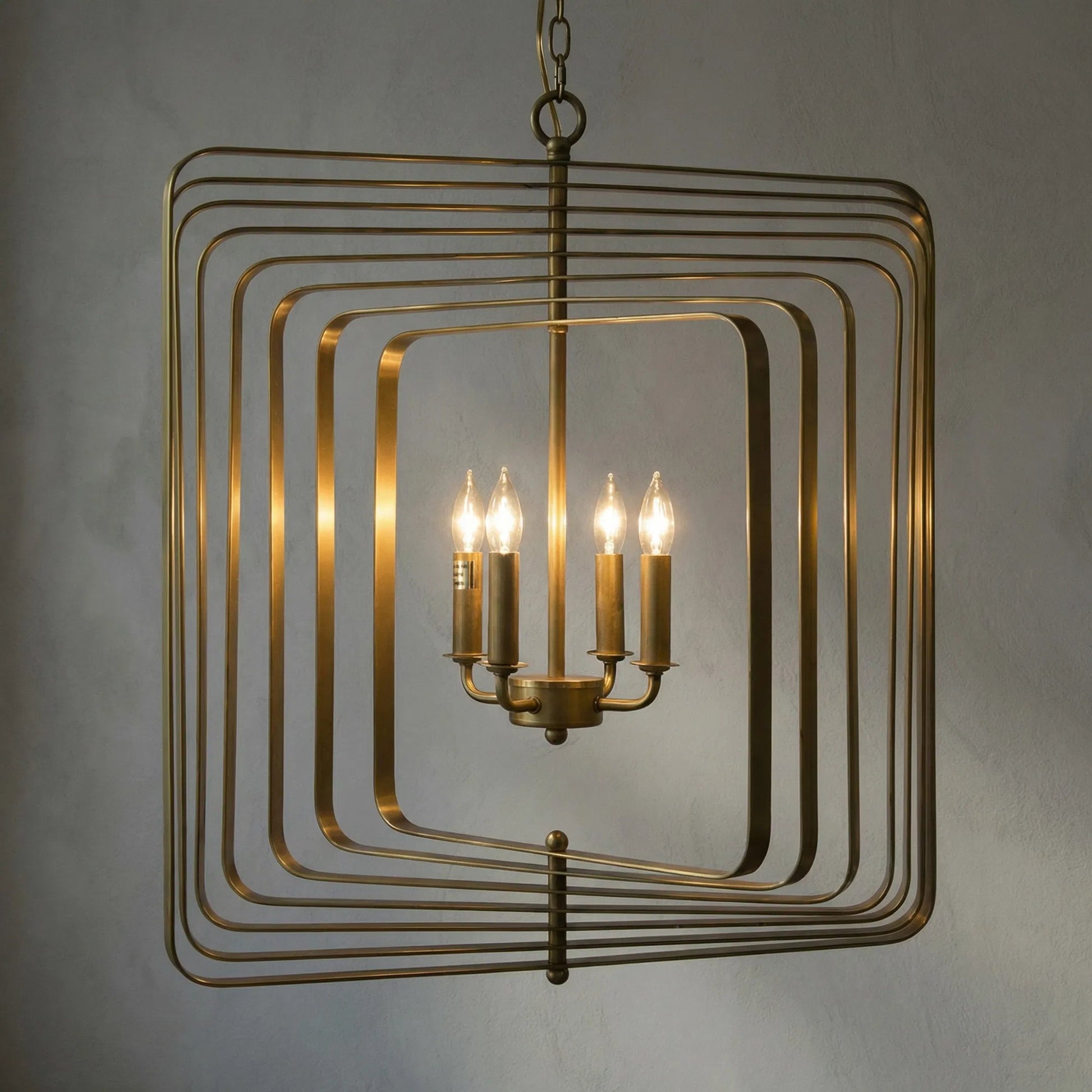Dimaclema Chandelier by Noir in antique brass. Made from metal in a modern style.
