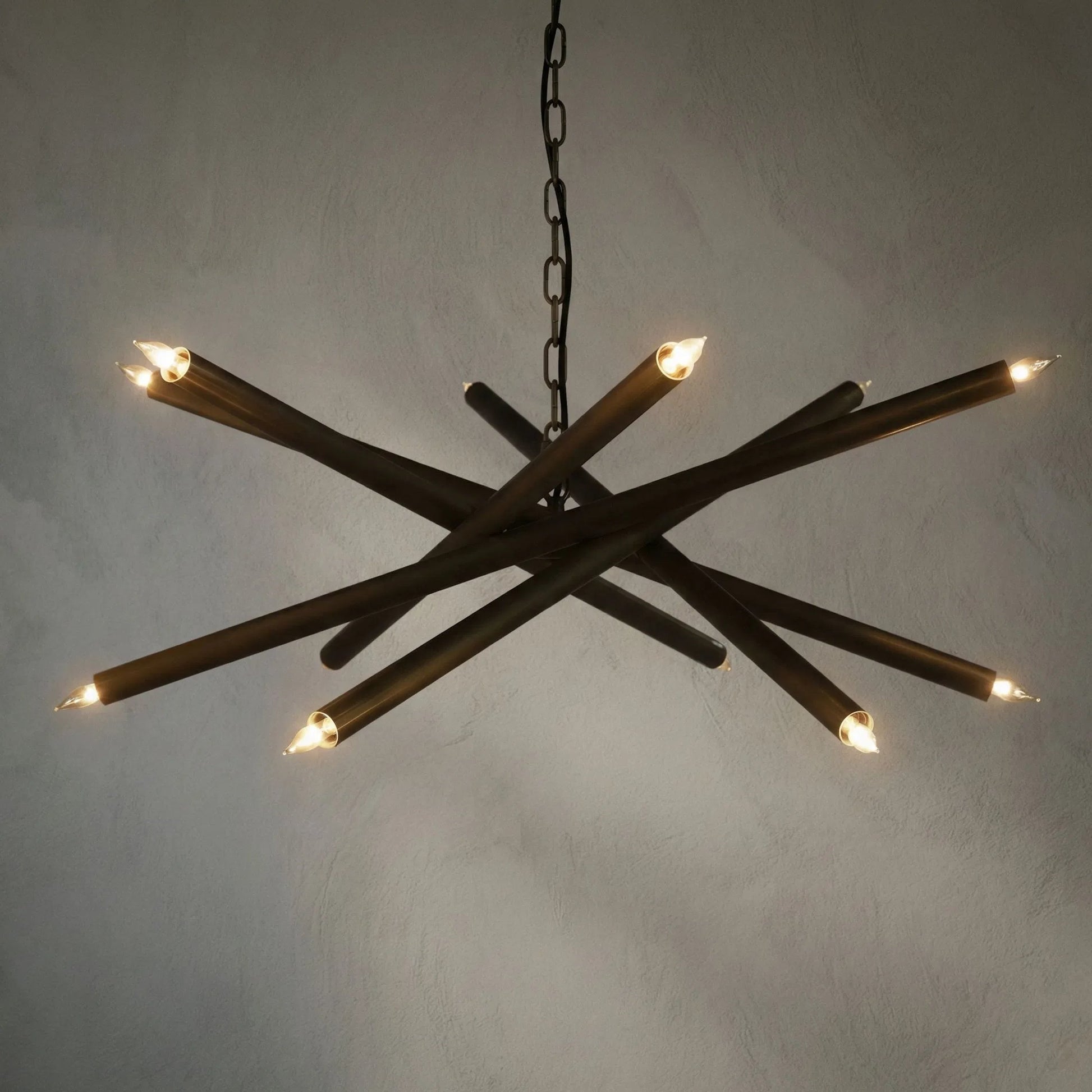 Ikram Chandelier by Noir in antique brass. Made from metal in a modern style.