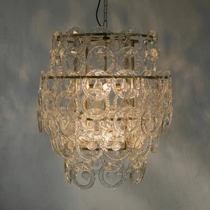 Quebec Chandelier by Noir in antique brass. Made from metal, glass in a transitional style.