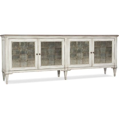 Arabella Four Door Credenza by Hooker Furniture in white. Made from maple veneers, eglomise with aluminum, metal buttons, nails in a cottage & farmhouse style.