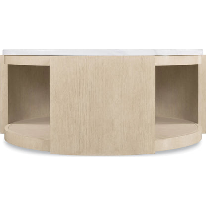 Westwood Round Cocktail Table by Hooker Furniture in polished limestone, quartered oak veneers. Made from glass reinforced concrete, oak veneers, leather, hair on hide leather in a transitional style.