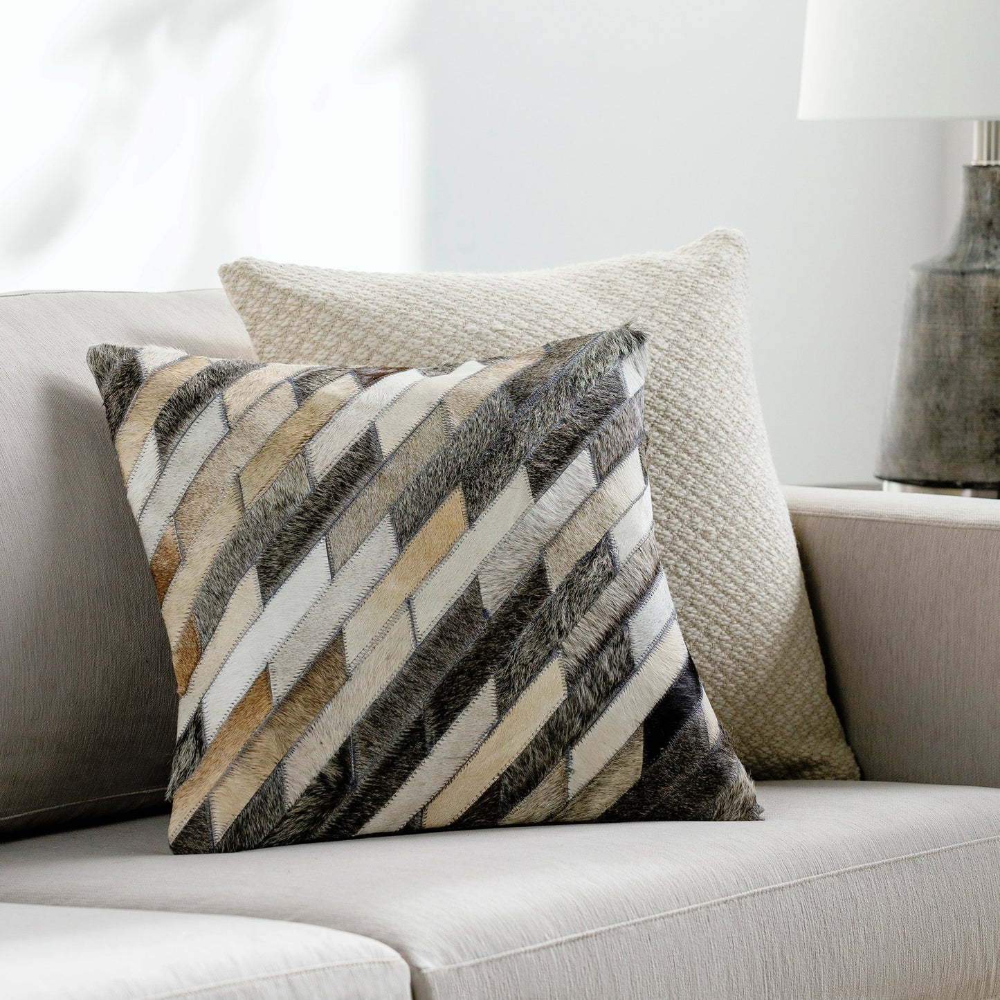 002 S-230026,S-230027 | Lifestyle | Lycaon Pillow - 17803 by Surya in white, dark brown, light gray, medium gray, black. Made from front: 100% hair on hide, back: 100% microsuede in a rustic style.