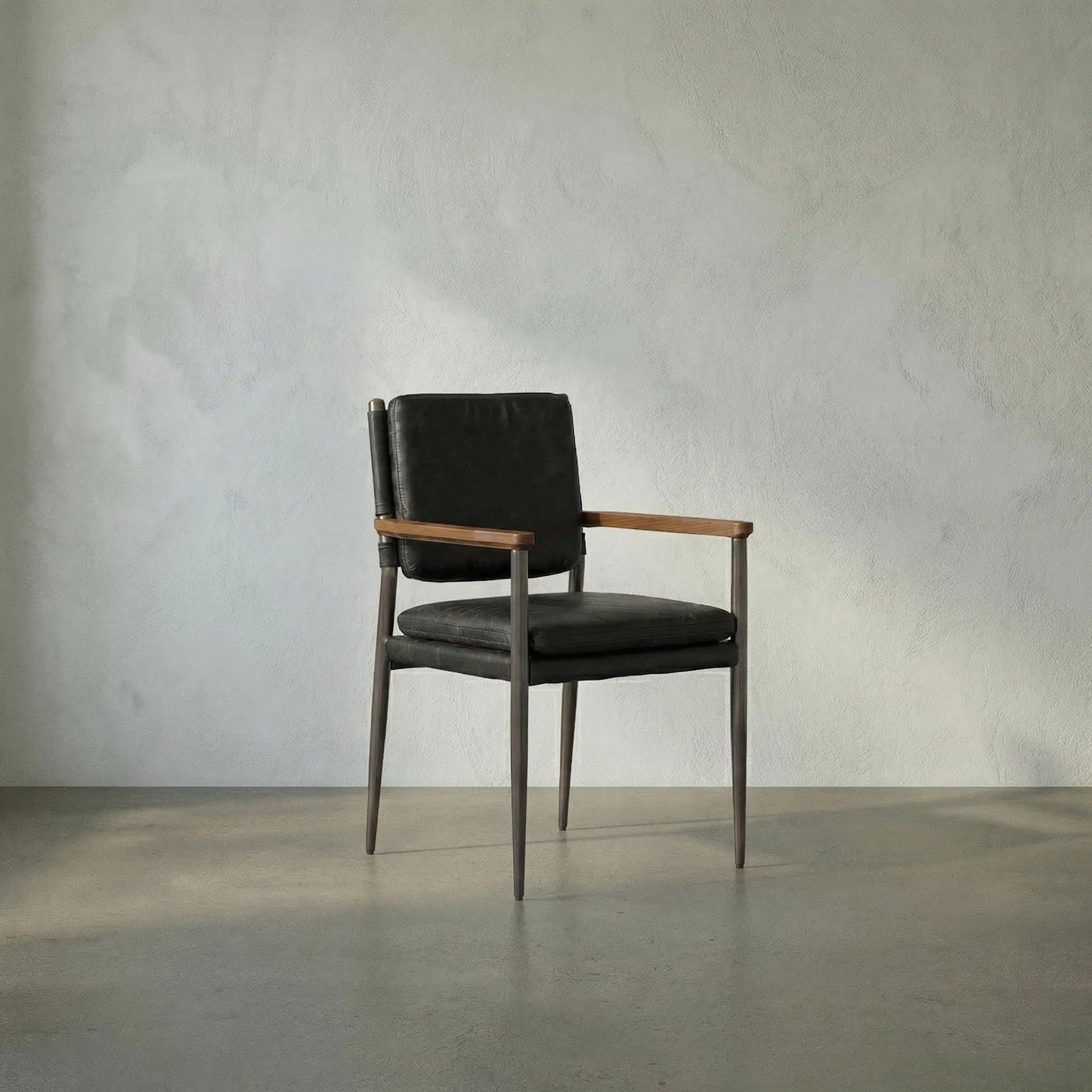 005 SI-2222937 | Lifestyle | Wooster Chair by Noir in steel gray powder coat, dark walnut, and ebony black. Made from industrial steel, walnut, and top-grain leather in a traditional style.