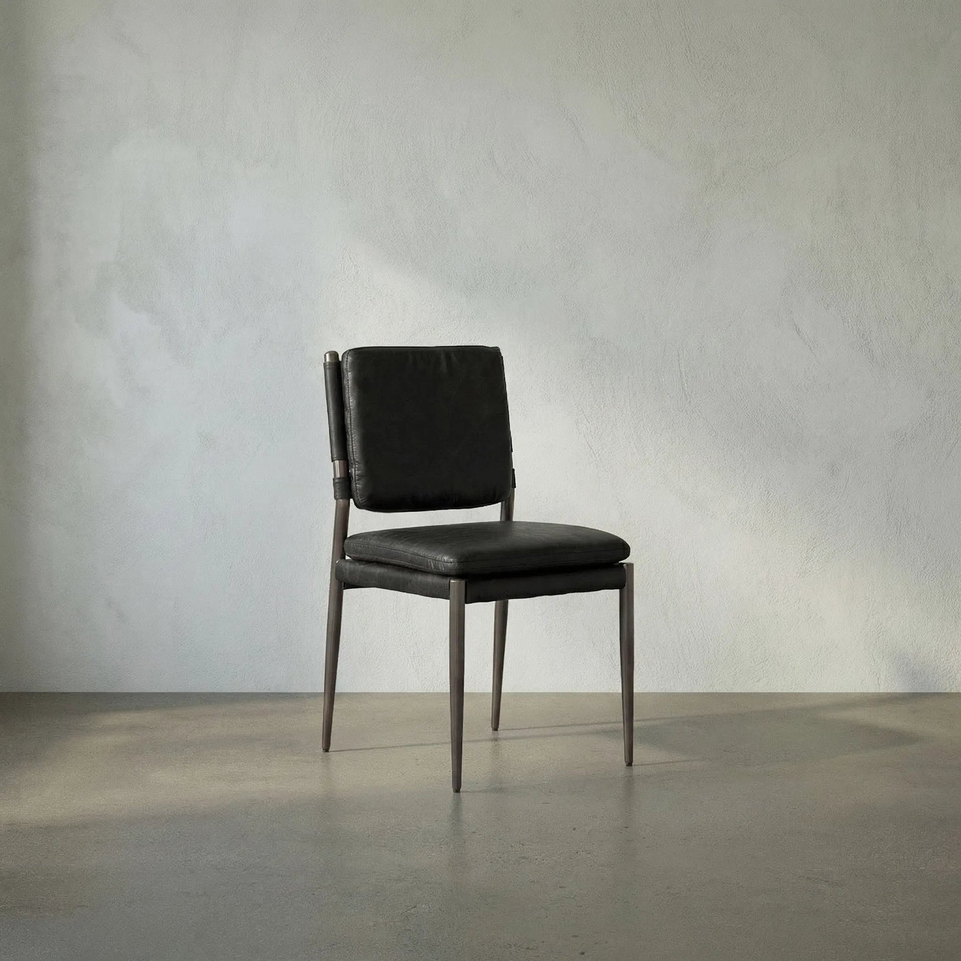 Elvis Chair by Noir in steel gray powder coat and ebony black. Made from industrial steel and top-grain leather in a modern style.