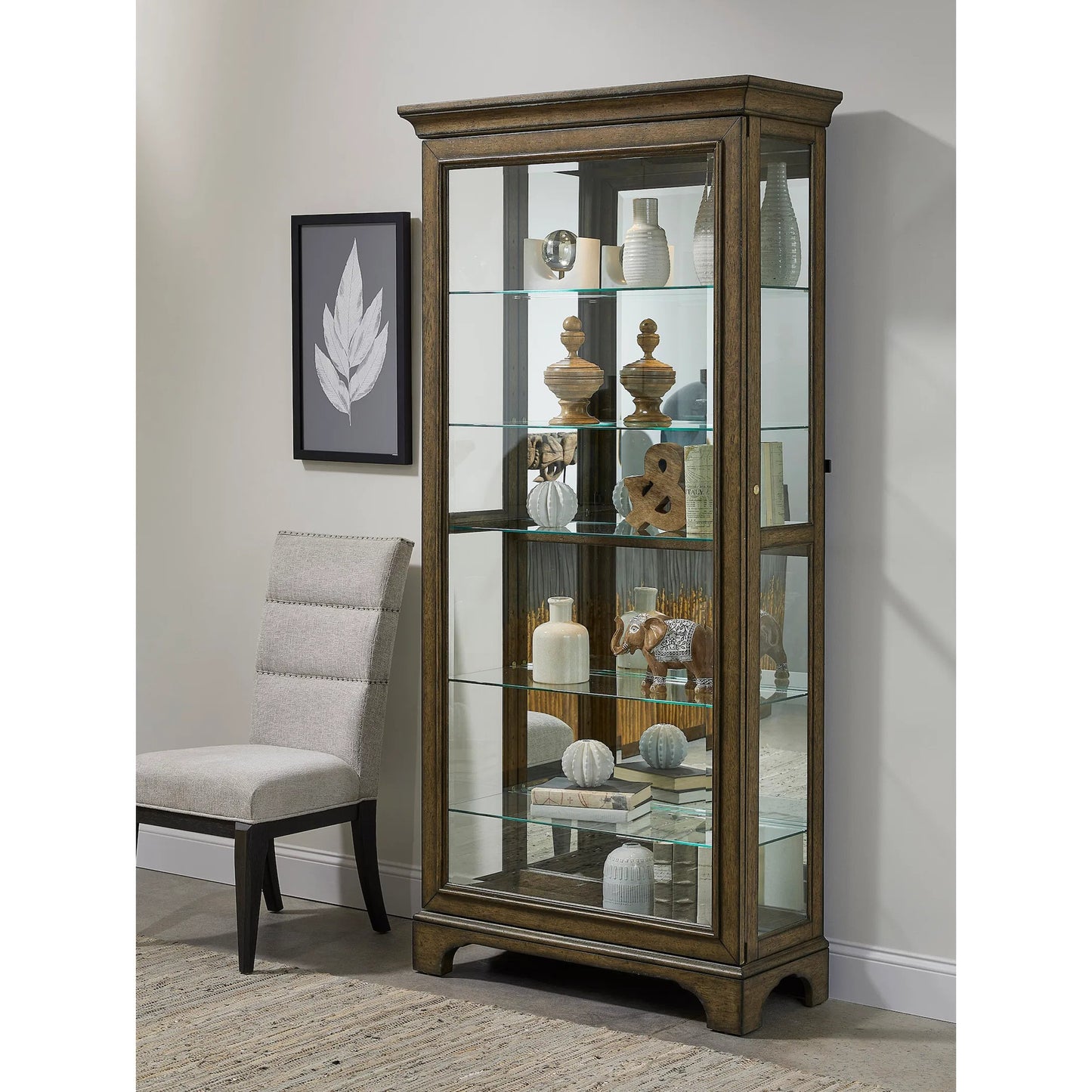 004 SI-2238729 | Lifestyle | Traditional Sliding Door Curio with Glass Shelves and LED Light by Pulaski Furniture in chestnut. Made from oak wood veneers in a unique style.