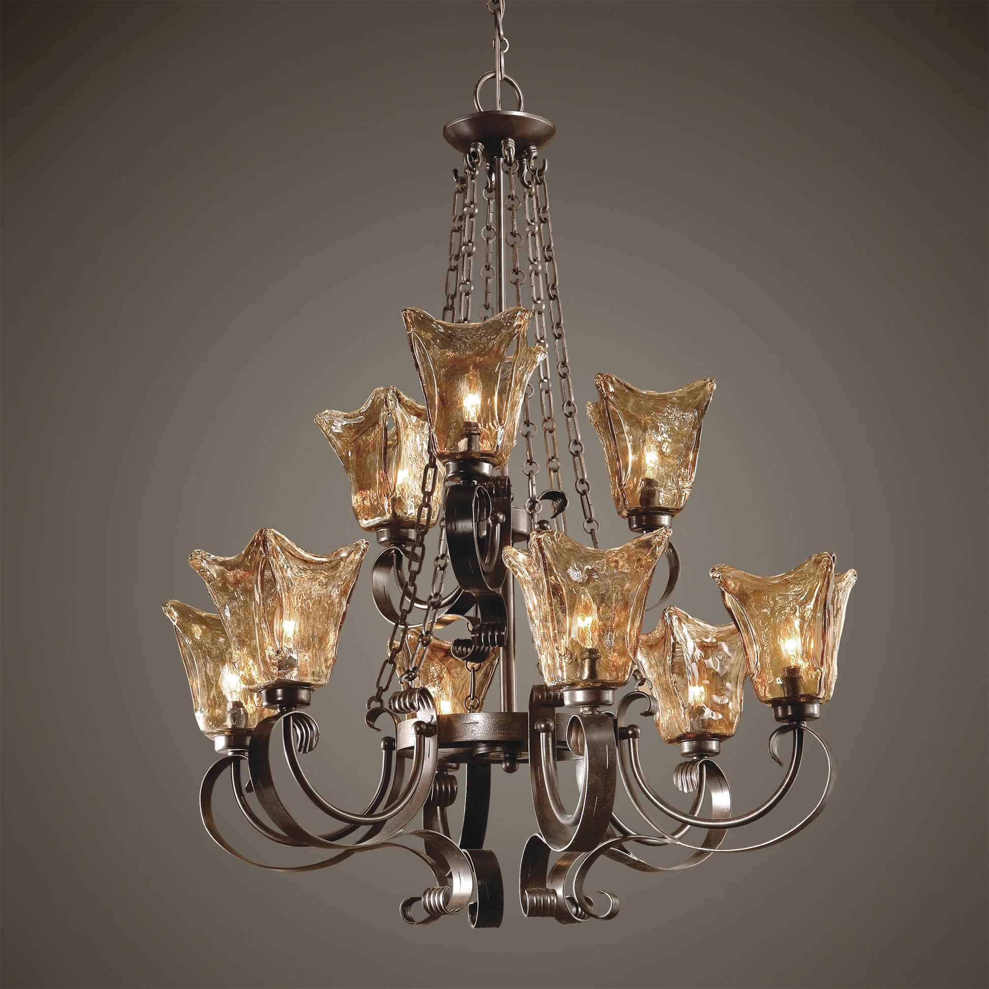 Vetraio Chandelier by Uttermost in bronze. Made from metal, brass, glass in a modern style.