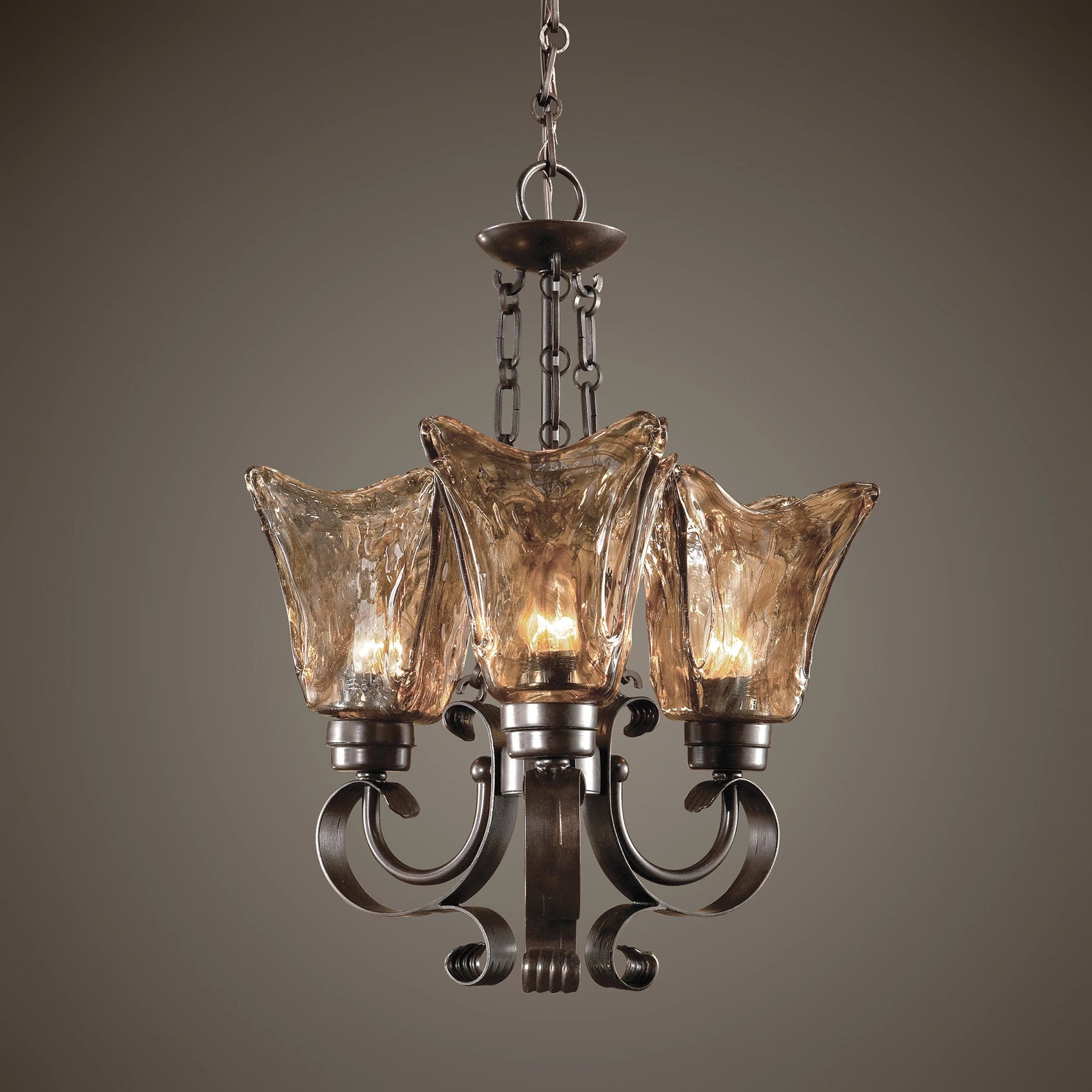 Vetraio Chandelier by Uttermost in bronze. Made from metal, brass, glass in a modern style.