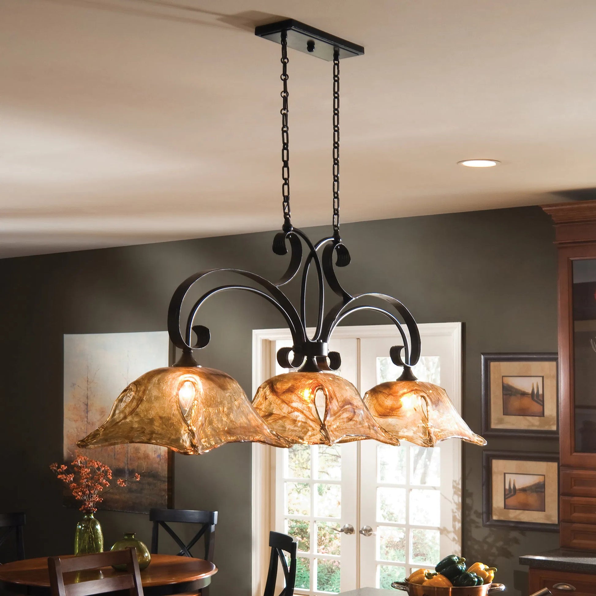 Vetraio Kitchen Island Light by Uttermost in bronze. Made from brass, metal, glass in a rustic style.