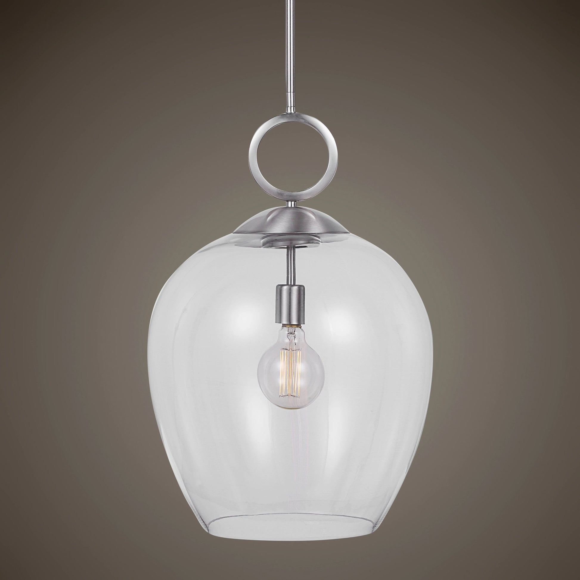 Calix Pendant by Uttermost in aged brass. Made from steel, glass in a transitional style.