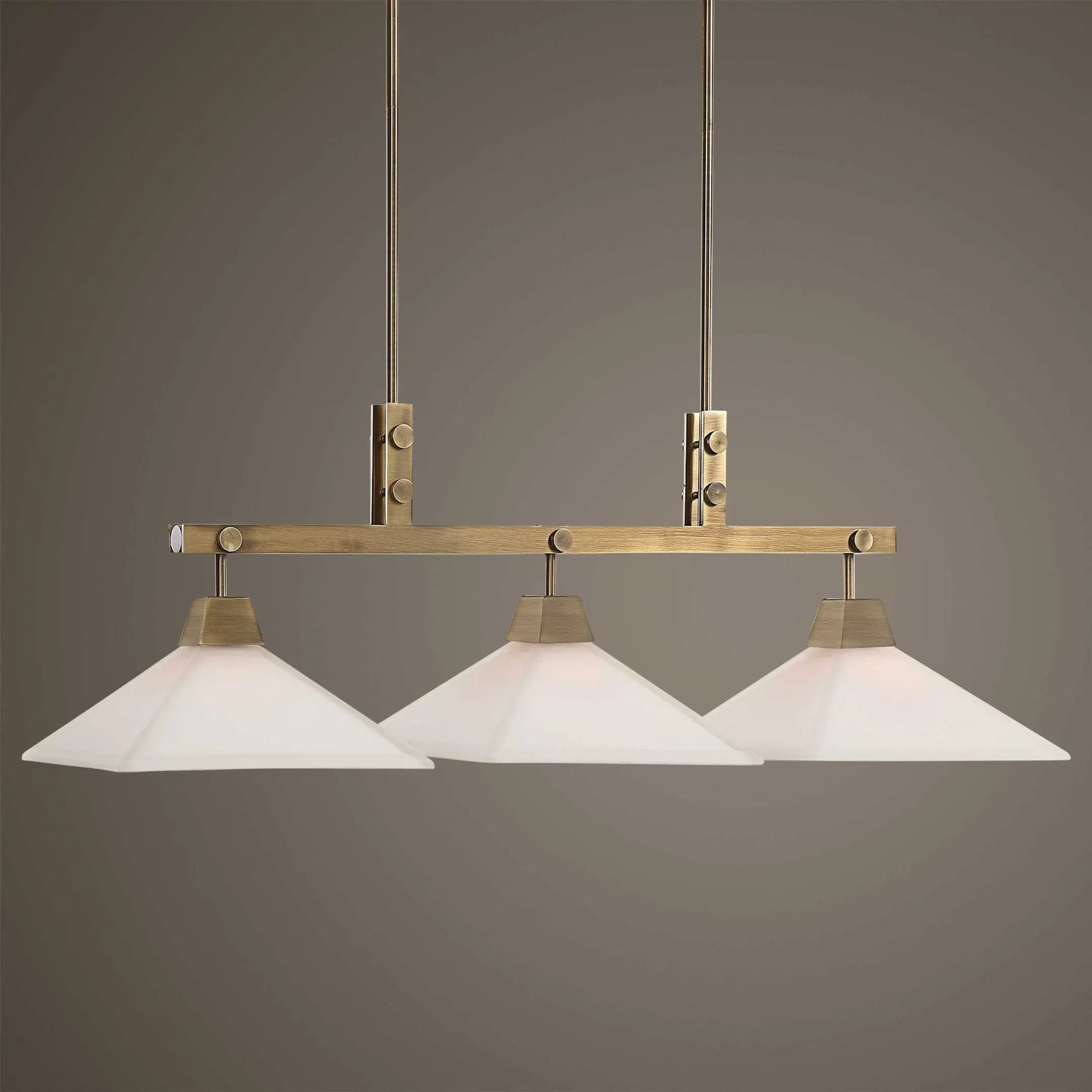 Brookdale Linear Chandelier by Uttermost in aged brass. Made from glass, steel in a transitional style.