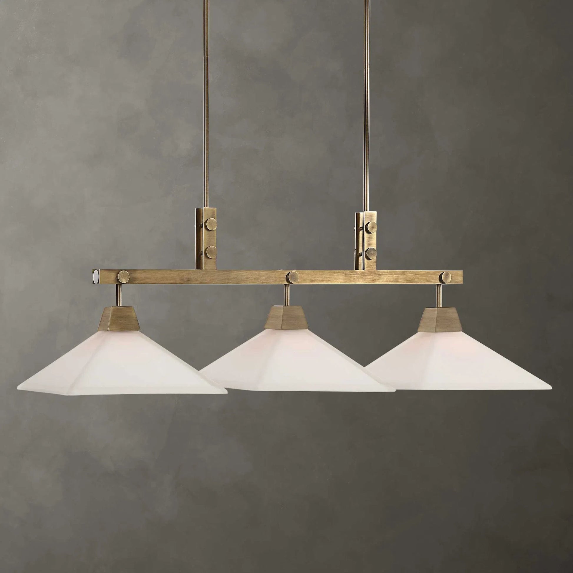 Brookdale Linear Chandelier by Uttermost in aged brass. Made from glass, steel in a transitional style.