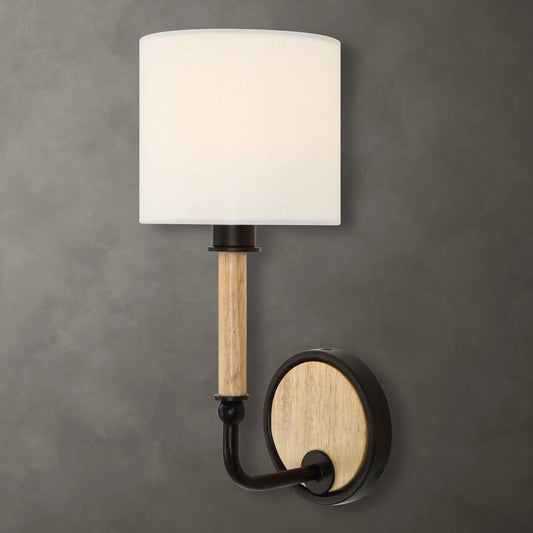 Franconia 1 Light Sconce by Uttermost in black, woodtone. Made from iron, rubber wood, white linen fabric in a unique style.