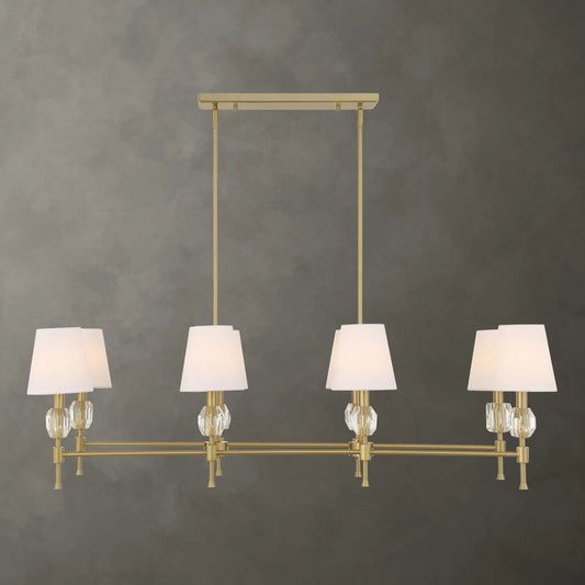Arques 8 Light Linear Chandelier by Uttermost in brass. Made from iron, fabric, crystal in a unique style.