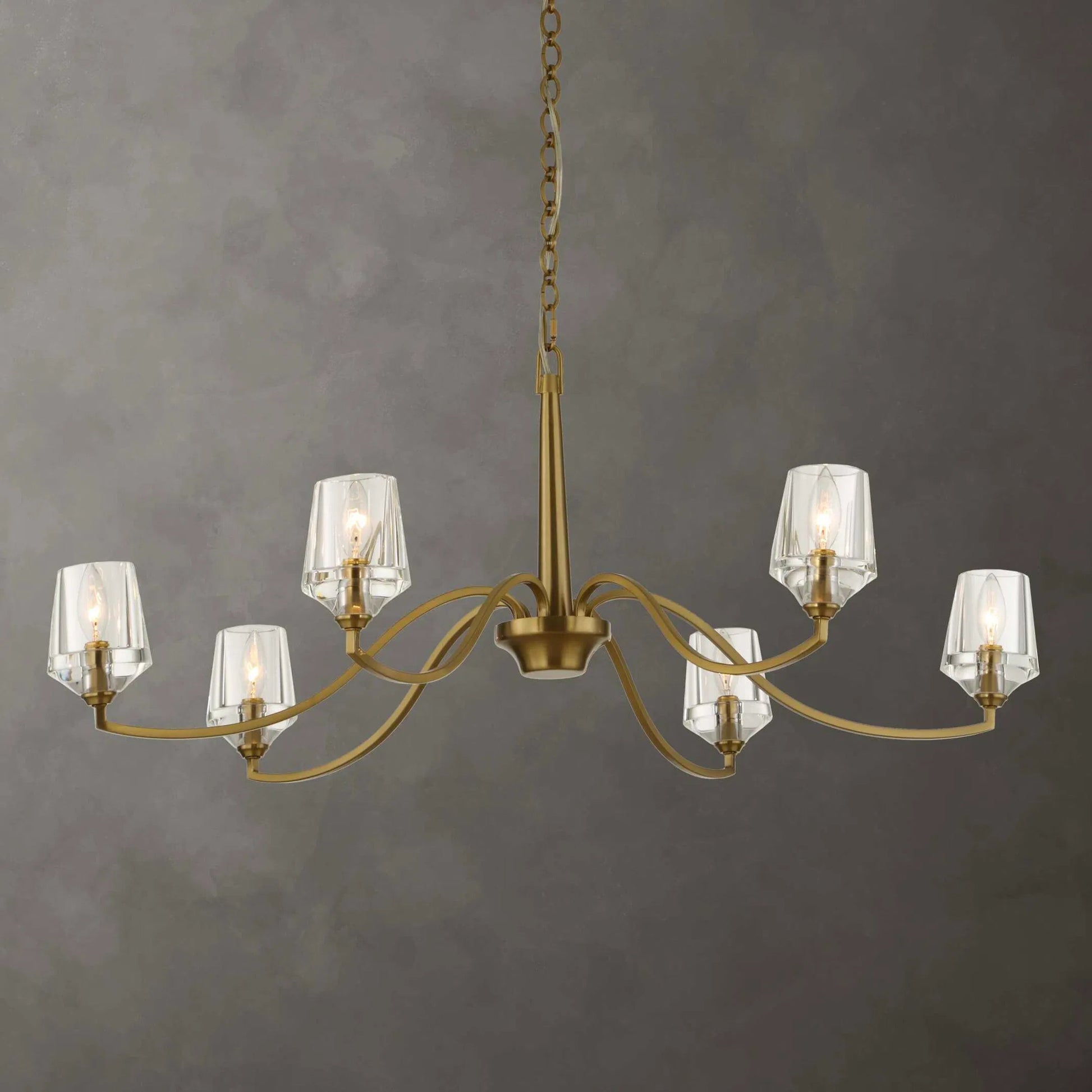 Barcelona 6 Light Chandelier by Uttermost in brass. Made from iron, crystal in a modern style.