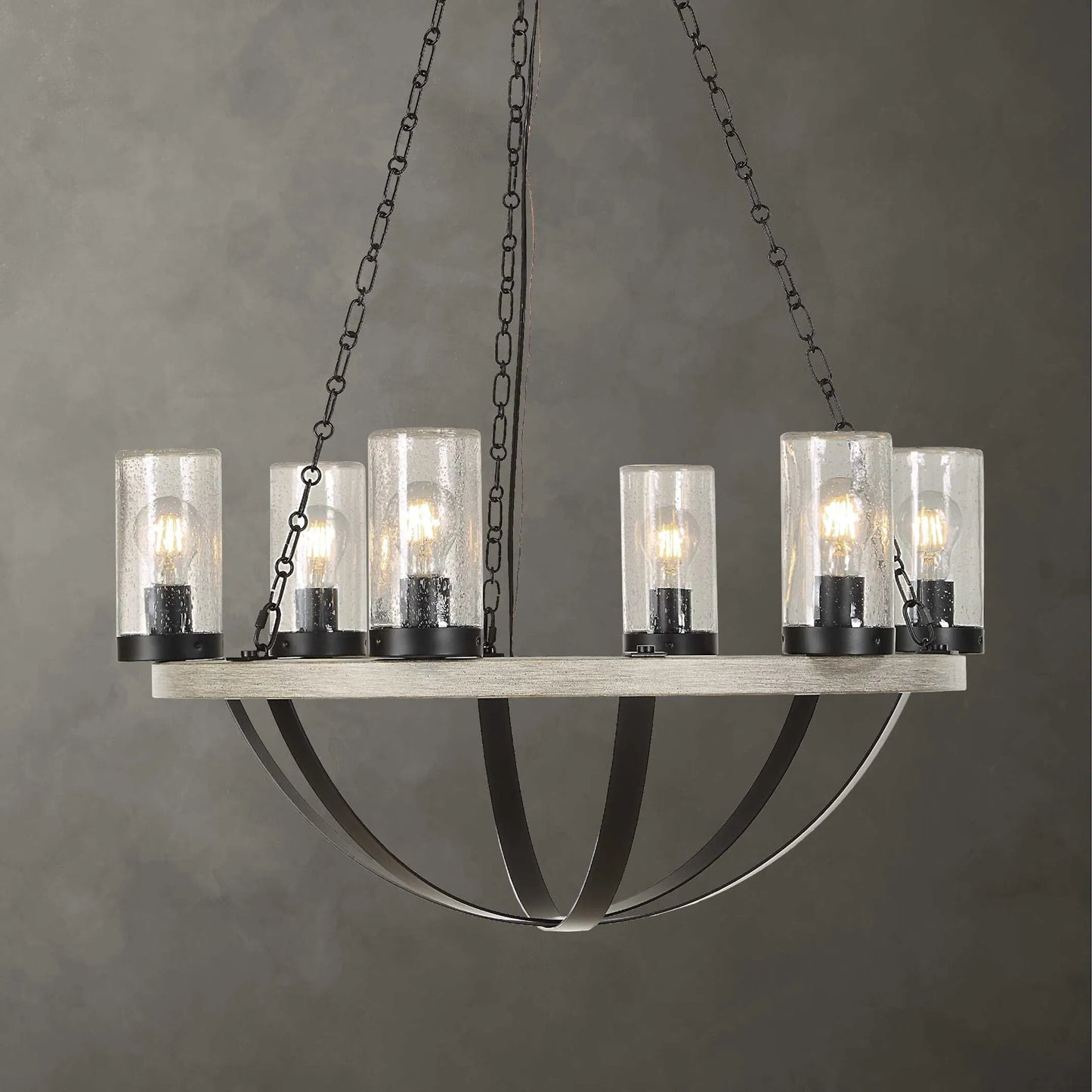 004 SI-2630594 | Unknown | Edgecomb 6 Light Indoor/Outdoor Chandelier by Uttermost in black and black. Made from iron, clear seeded glass in a unique style.