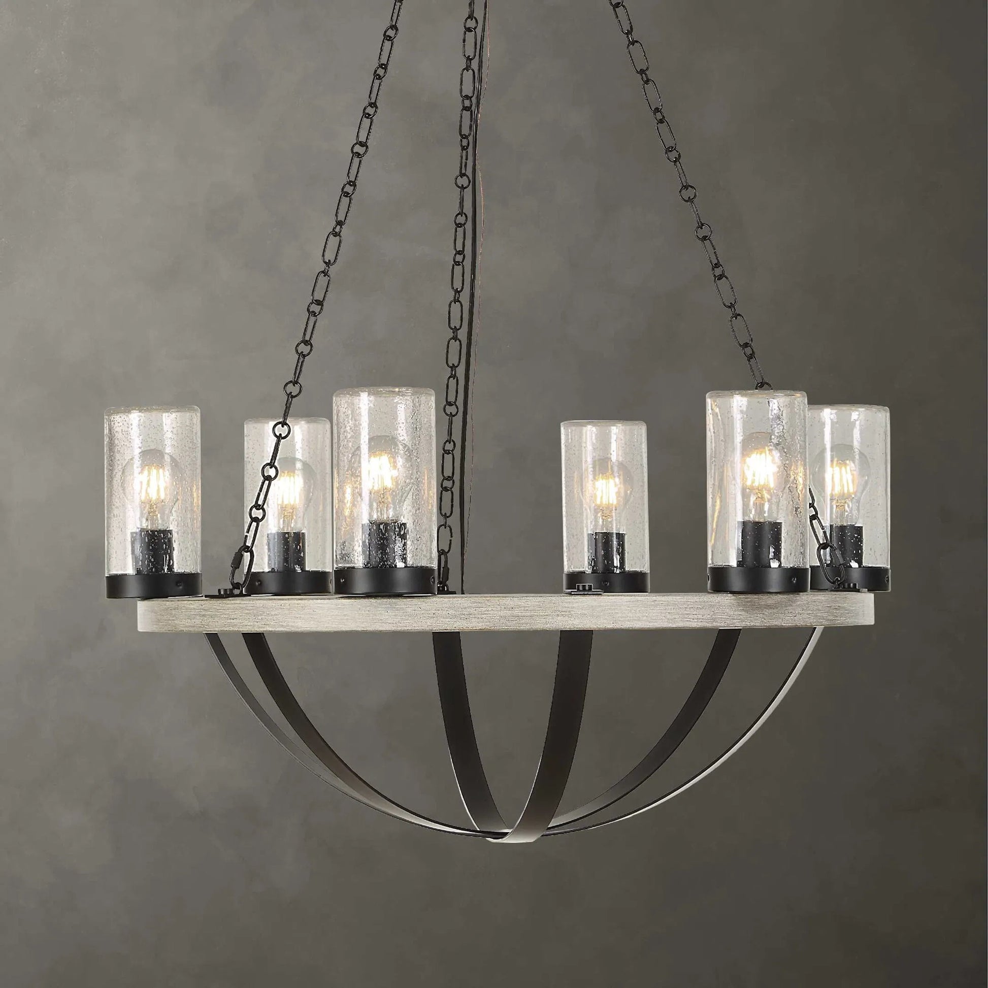 Edgecomb 6 Light Indoor/Outdoor Chandelier by Uttermost in black and black. Made from iron, clear seeded glass in a unique style.