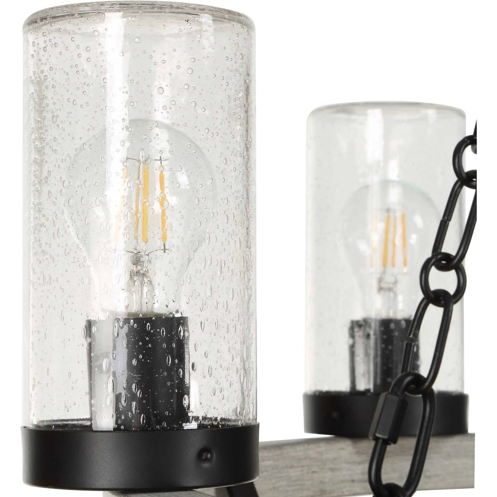 Edgecomb 6 Light Indoor/Outdoor Chandelier by Uttermost in black and black. Made from iron, clear seeded glass in a unique style.
