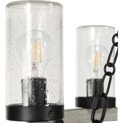 Edgecomb 6 Light Indoor/Outdoor Chandelier by Uttermost in black and black. Made from iron, clear seeded glass in a unique style.