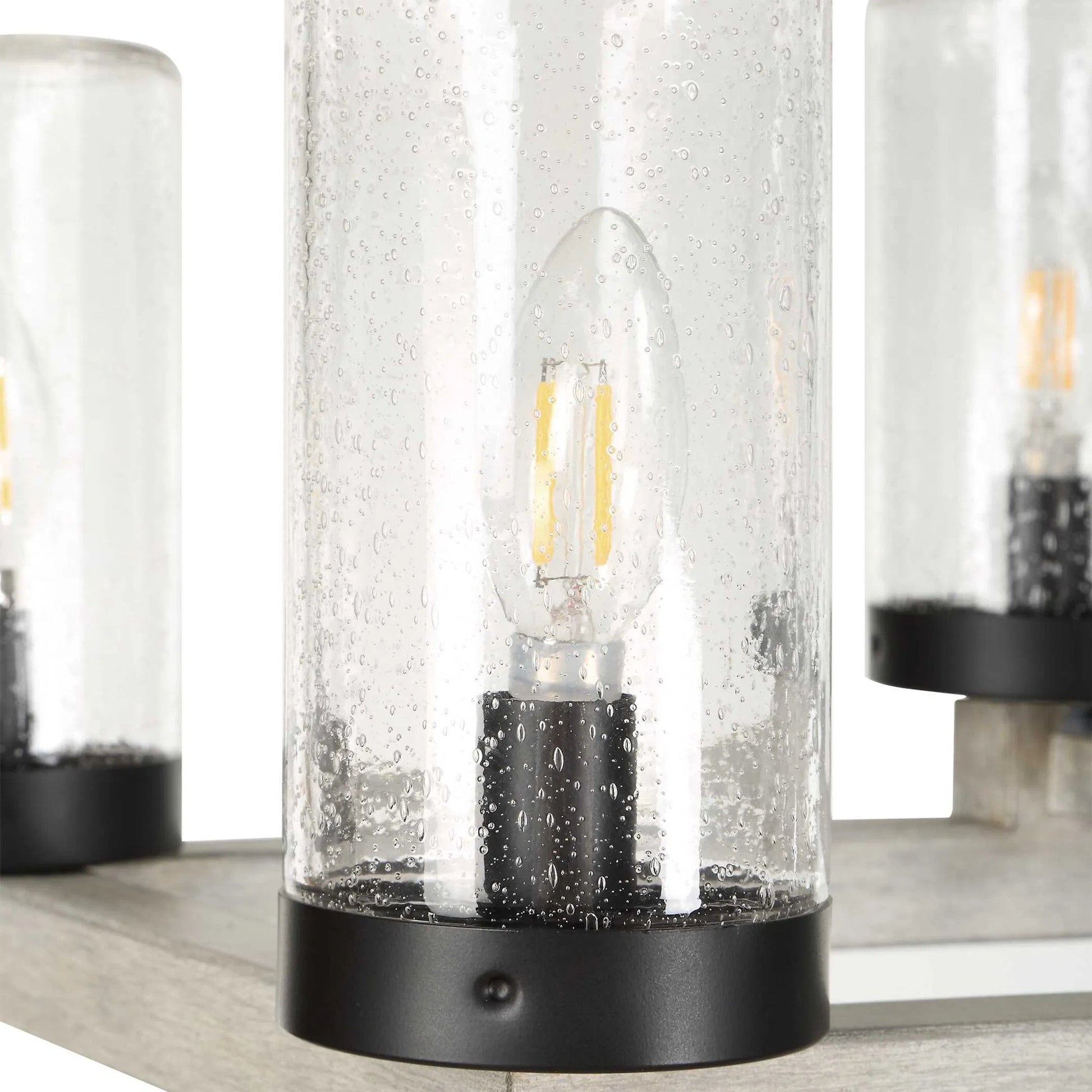 Edgecomb 10 Light Indoor/Outdoor Chandelier by Uttermost in black and black. Made from iron, clear seeded glass in a unique style.