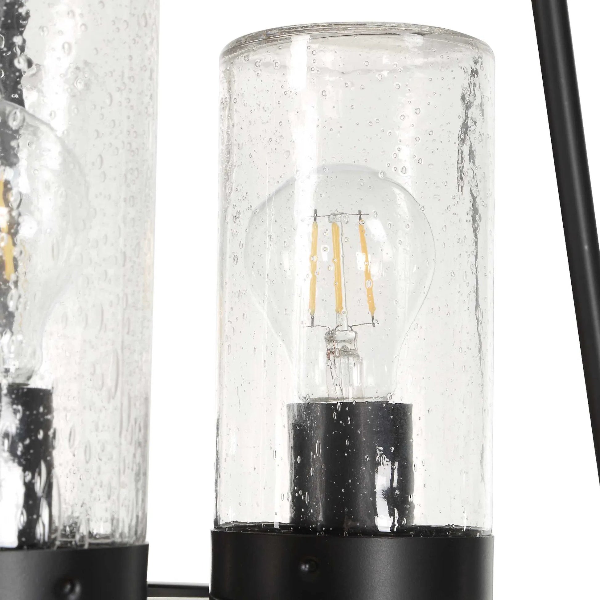 Edgecomb 4 Light Indoor/Outdoor Pendant by Uttermost in black and black. Made from iron, clear seeded glass in a unique style.
