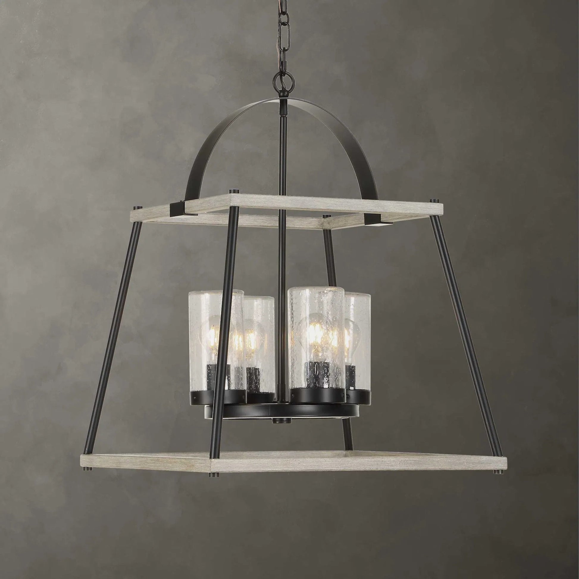 Edgecomb 4 Light Indoor/Outdoor Pendant by Uttermost in black and black. Made from iron, clear seeded glass in a unique style.