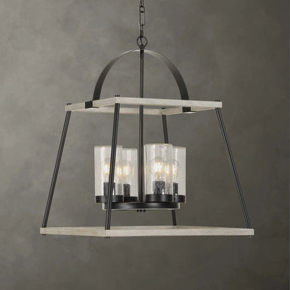 Edgecomb 4 Light Indoor/Outdoor Pendant by Uttermost in black and black. Made from iron, clear seeded glass in a unique style.