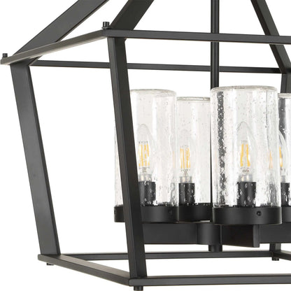 Evanston 4 Light Indoor/Outdoor Pendant by Uttermost in black and black. Made from opal glass in a unique style.