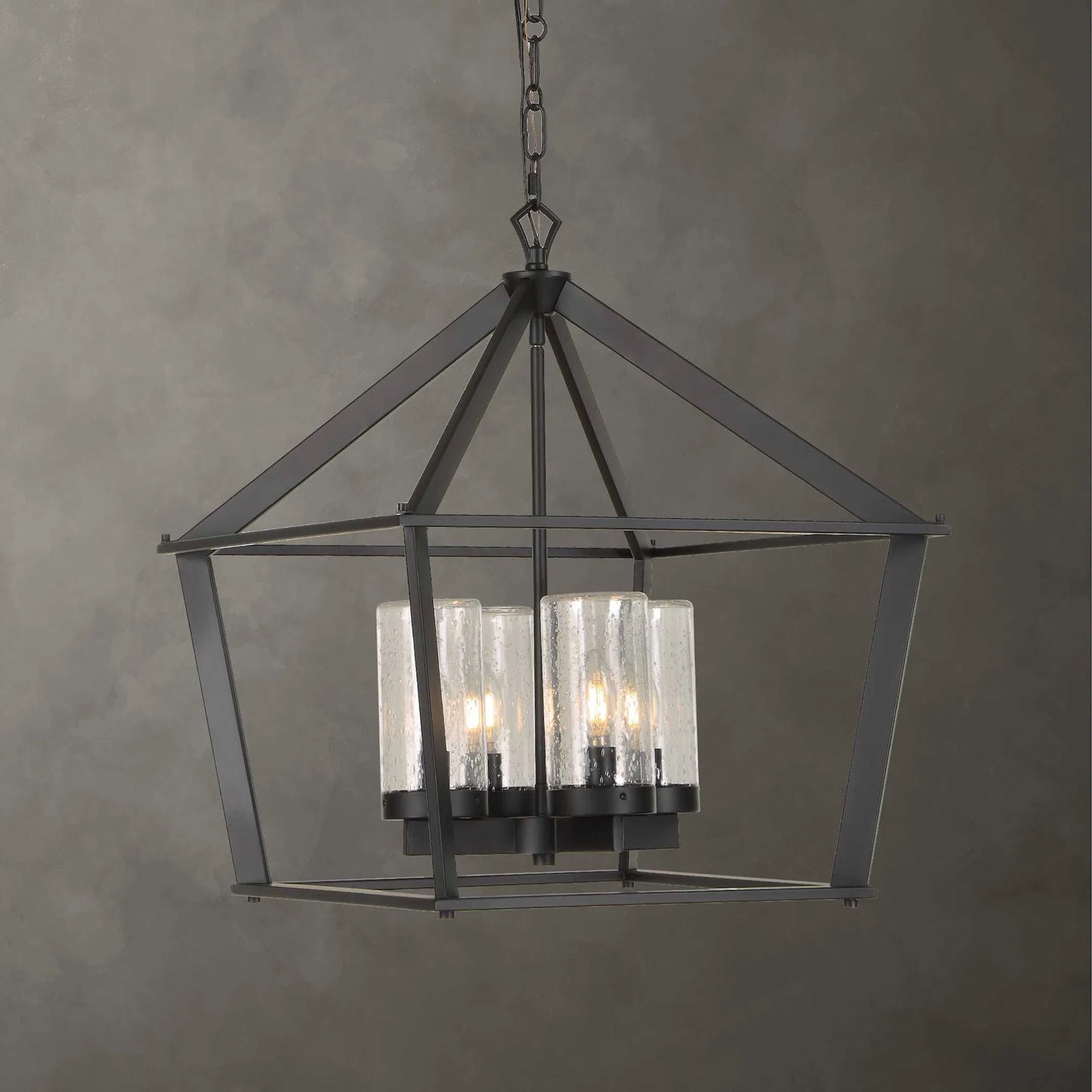 003 SI-2630601 | Lifestyle | Evanston 4 Light Indoor/Outdoor Pendant by Uttermost in black and black. Made from opal glass in a unique style.