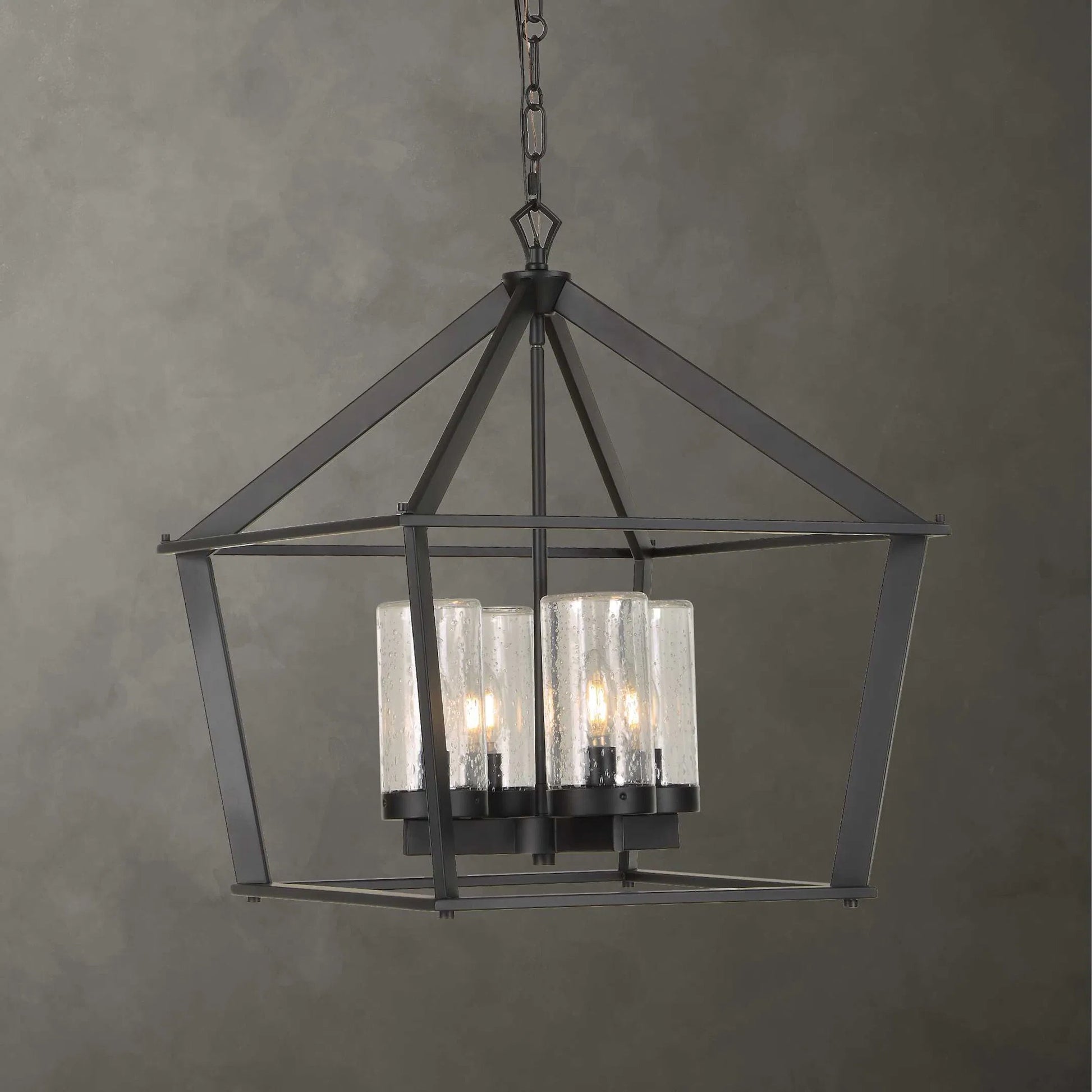 Evanston 4 Light Indoor/Outdoor Pendant by Uttermost in black and black. Made from opal glass in a unique style.