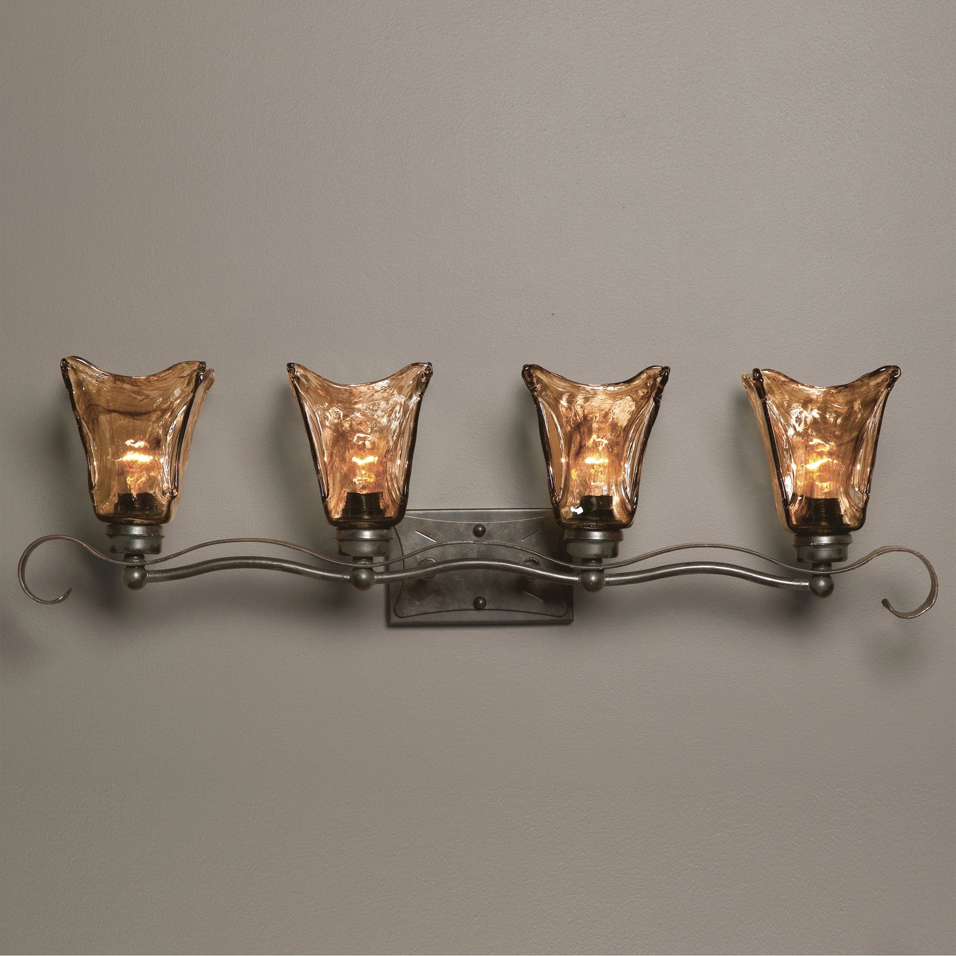 Vetraio Vanity Strip by Uttermost in bronze. Made from metal, brass, glass in a rustic style.