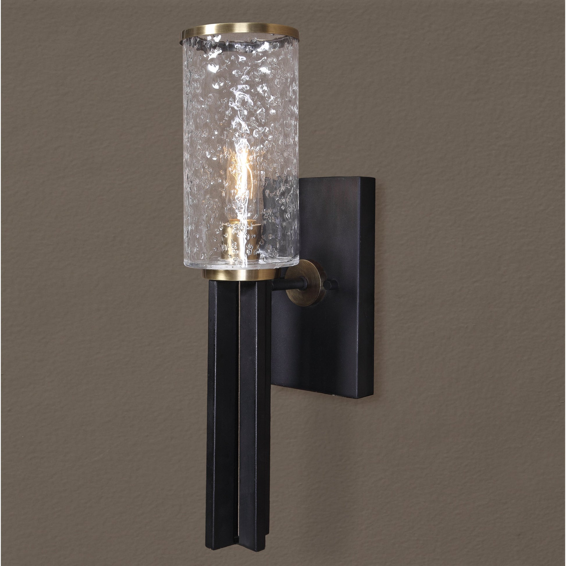 Jarsdel Industrial Sconce by Uttermost. Made from steel, glass in a modern style.