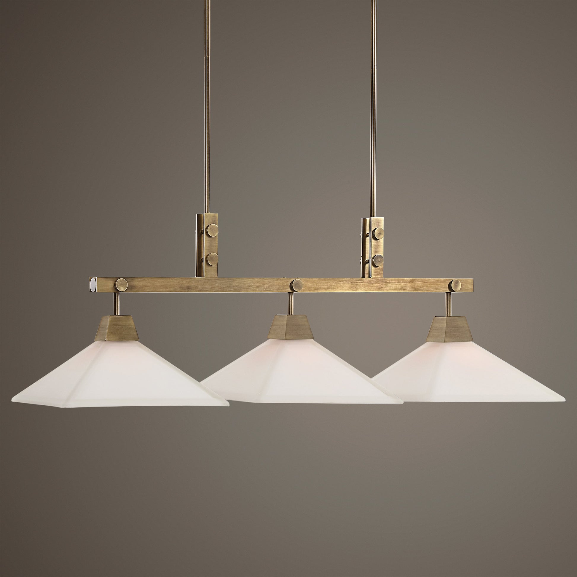 Brookdale Linear Chandelier by Uttermost in aged brass. Made from glass, steel in a transitional style.