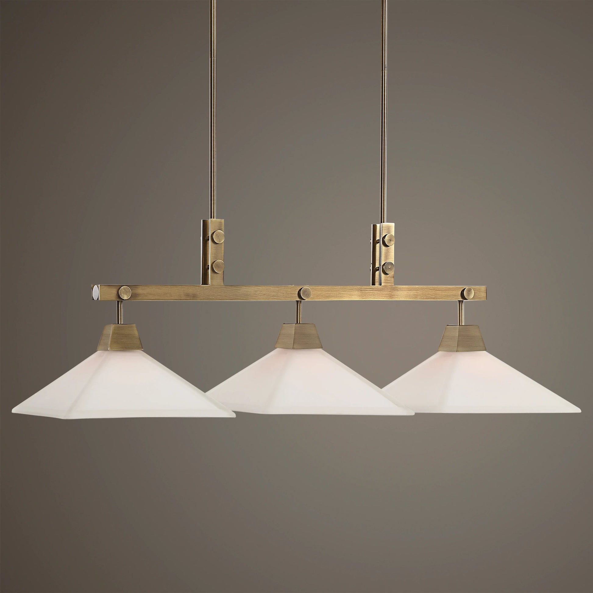Brookdale Linear Chandelier by Uttermost in aged brass. Made from glass, steel in a transitional style.