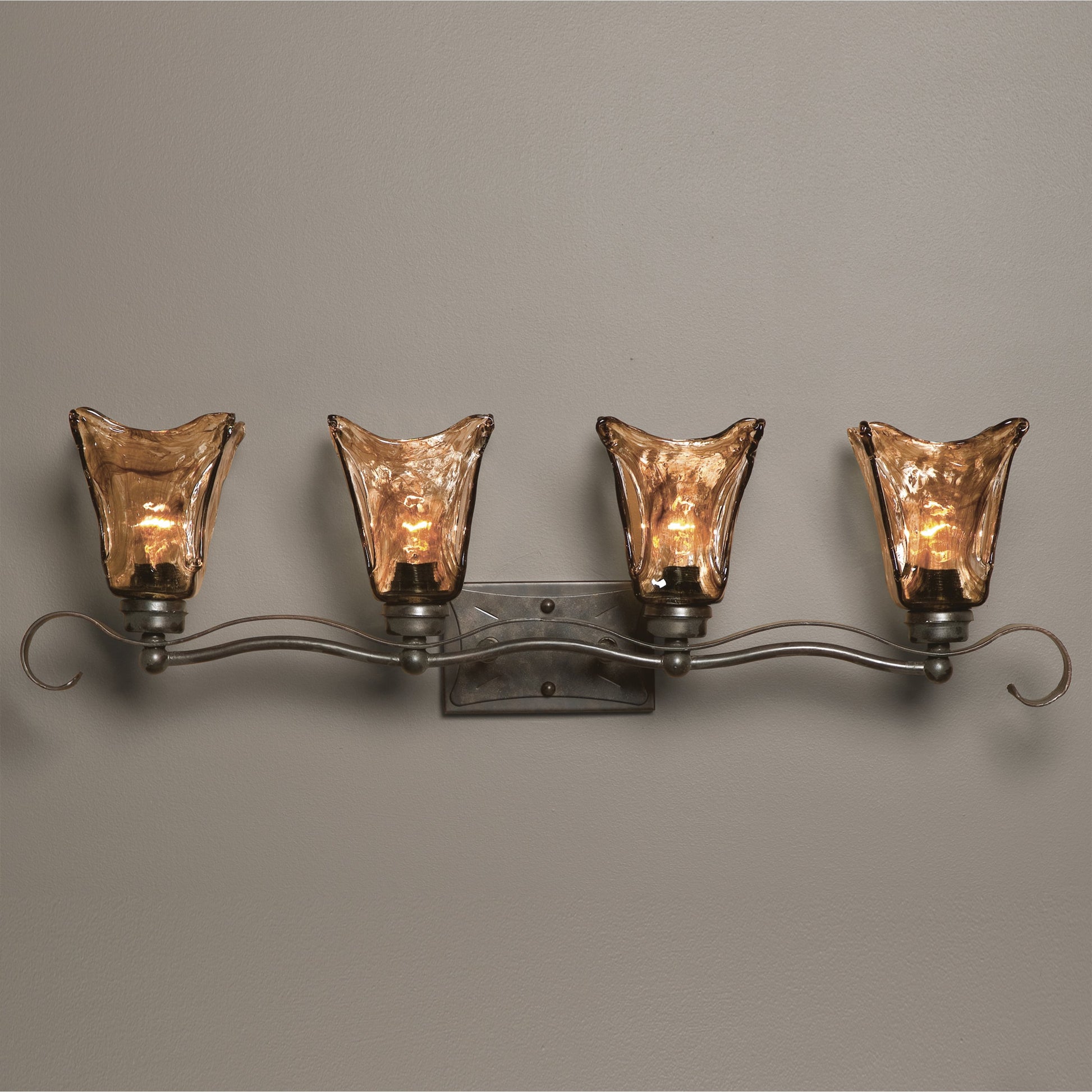 Vetraio Vanity Strip by Uttermost in bronze. Made from metal, brass, glass in a rustic style.
