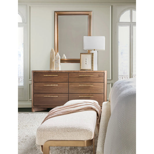 Eleana Dresser by Hooker Furniture in light caramel, quartered walnut veneers, sunlit bronze metal. Made from walnut veneers in a traditional style.