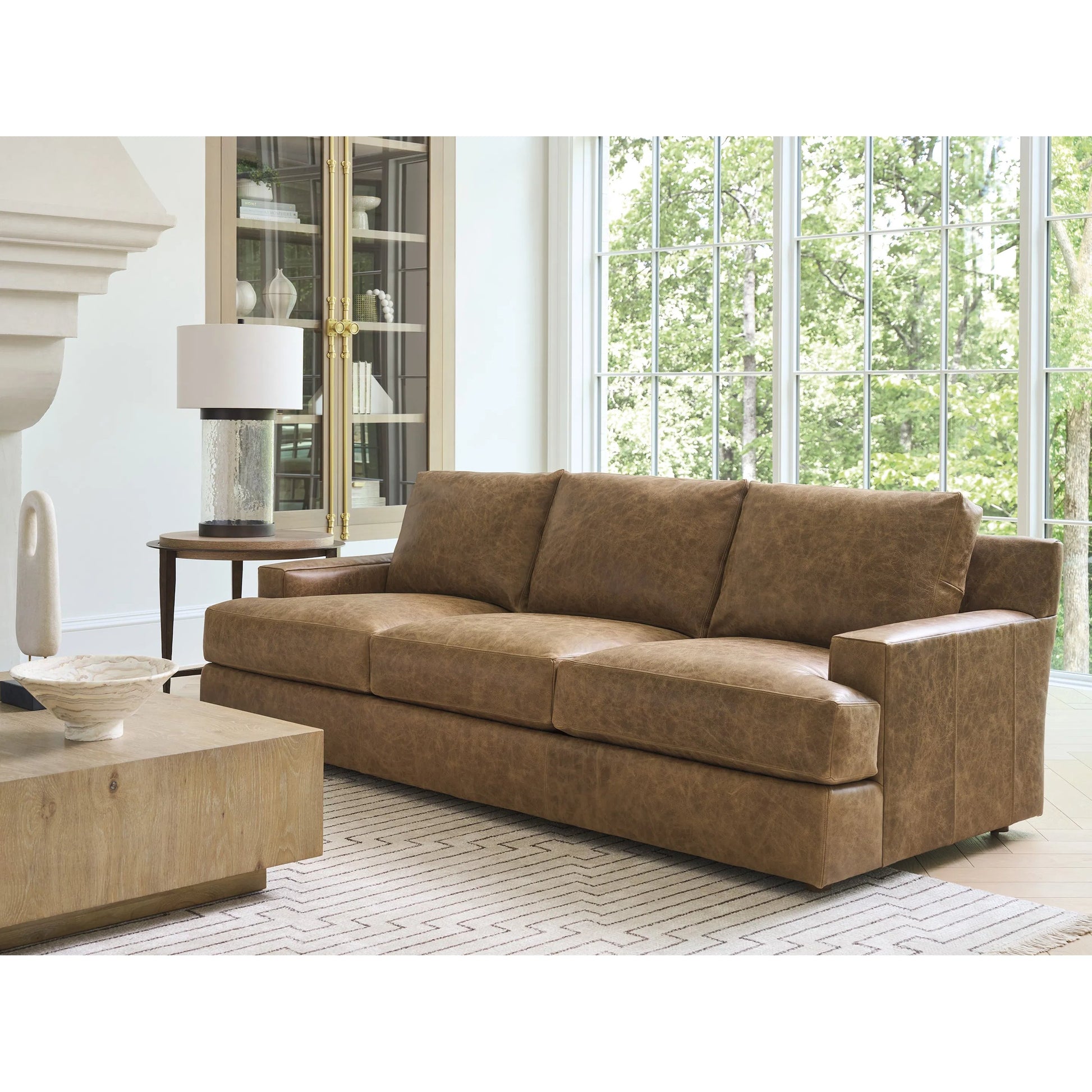 Millington Leather Sofa by Barclay Butera in brown. Made from mahogany, leather in a unique style.