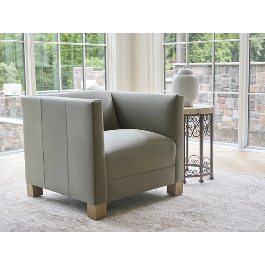 Chandler Leather Chair by Barclay Butera in green and tan. Made from mahogany, leather in a unique style.