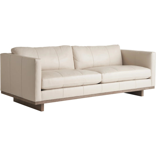 Brixton Leather Sofa by Tommy Bahama Home in white, ivory and brown. Made from white oak, leather in a unique style.