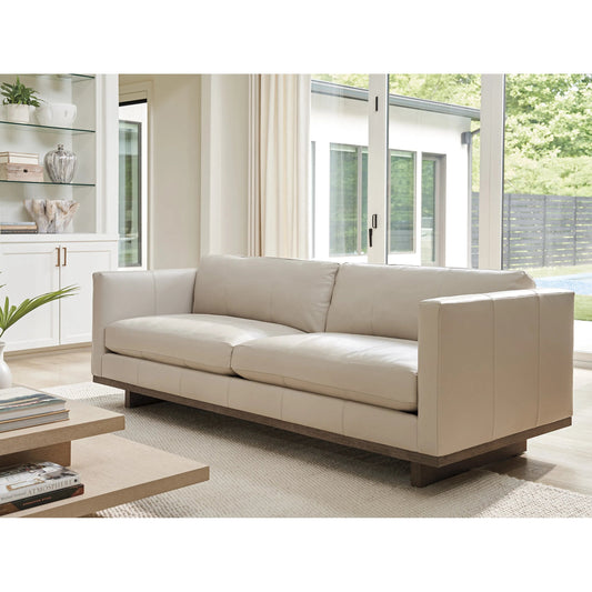 Brixton Leather Sofa by Tommy Bahama Home in white, ivory and brown. Made from white oak, leather in a unique style.