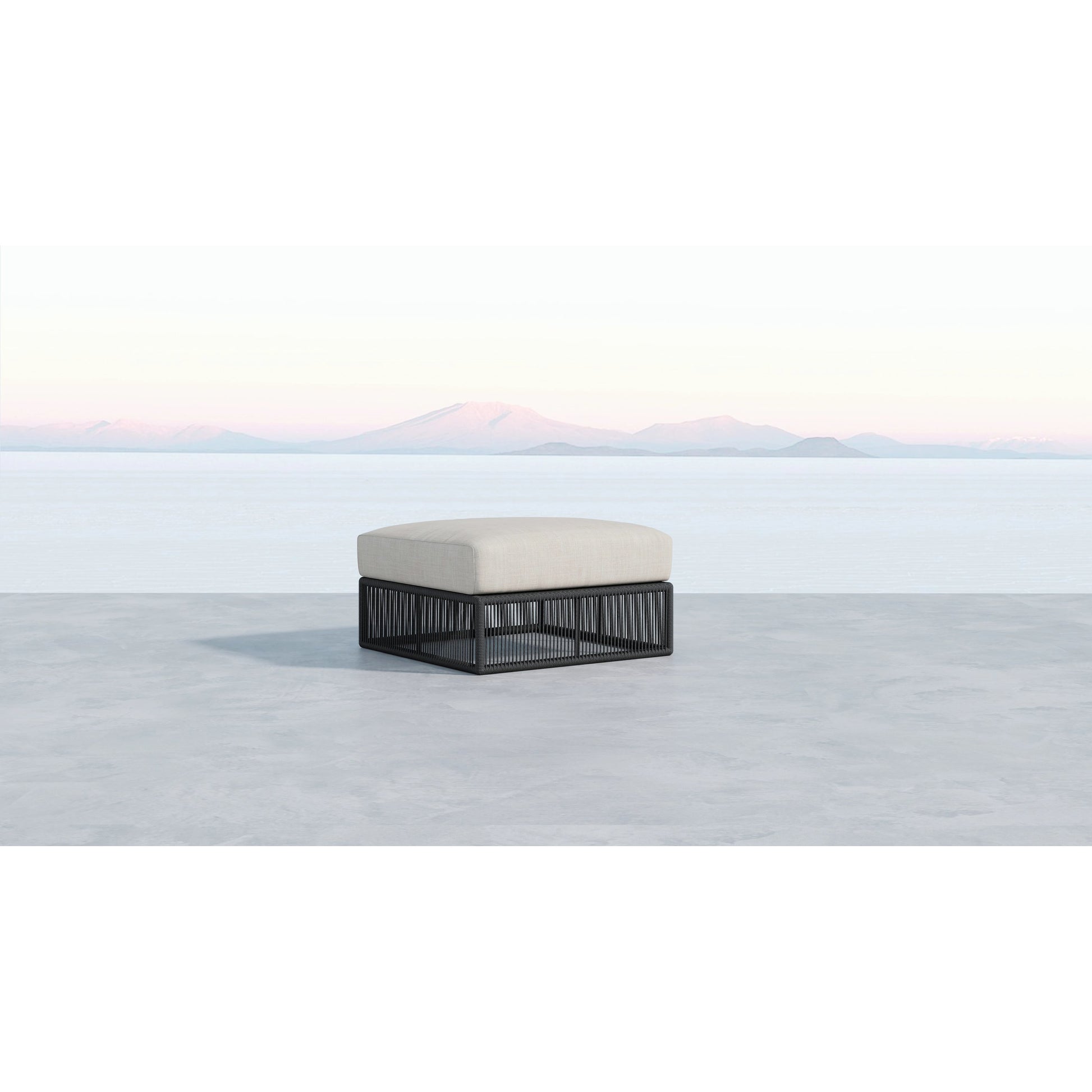 Milano Outdoor Ottoman by Sunset West in slate. Made from olefin rope in a coastal style.